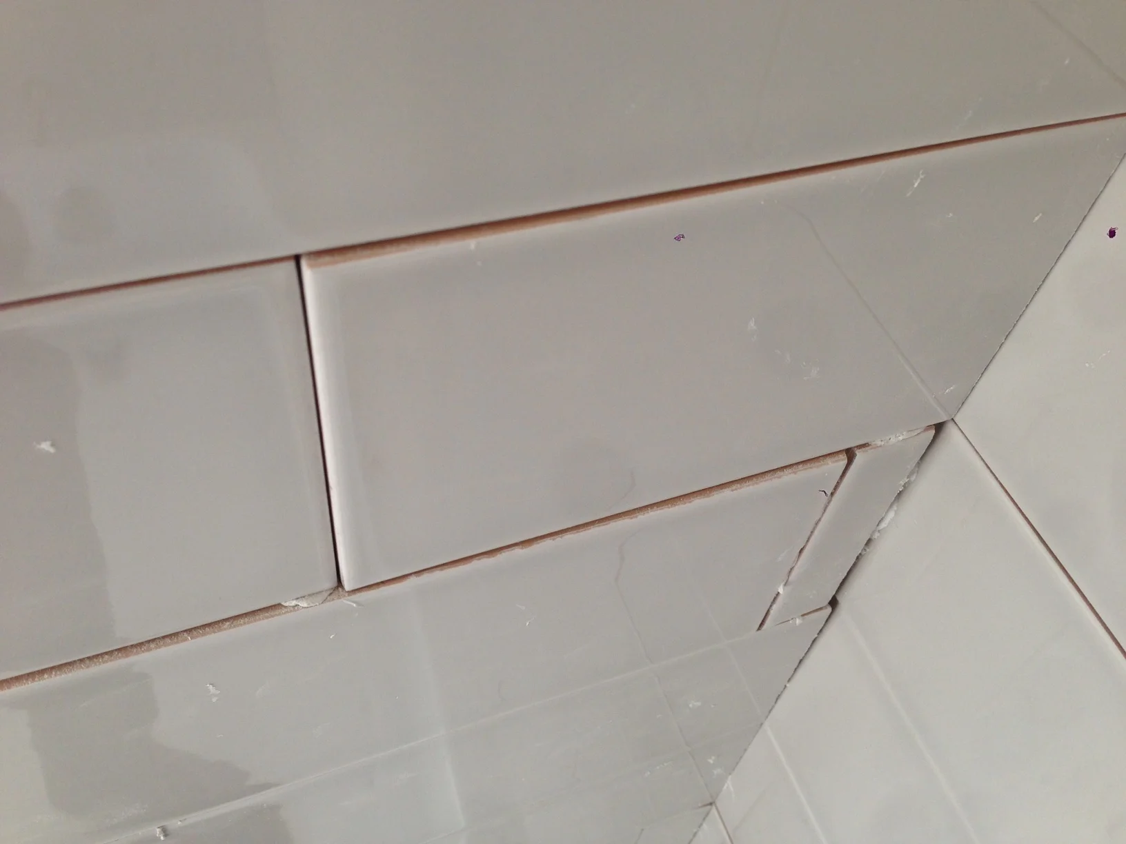 One example where the tile is not flush. These walls were bad.