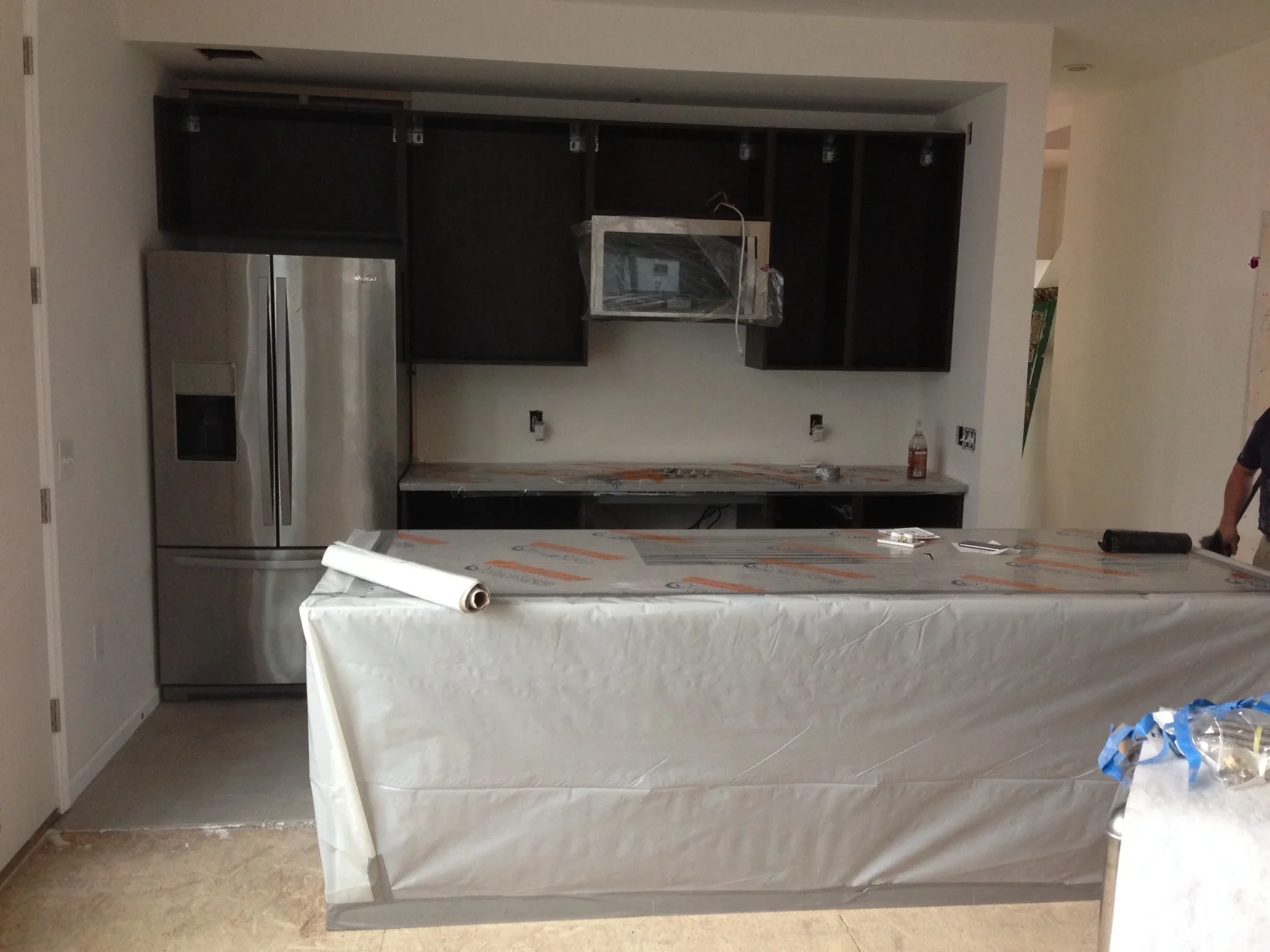 Coming together. One day it will be done. For now it is wrapped and protected. 