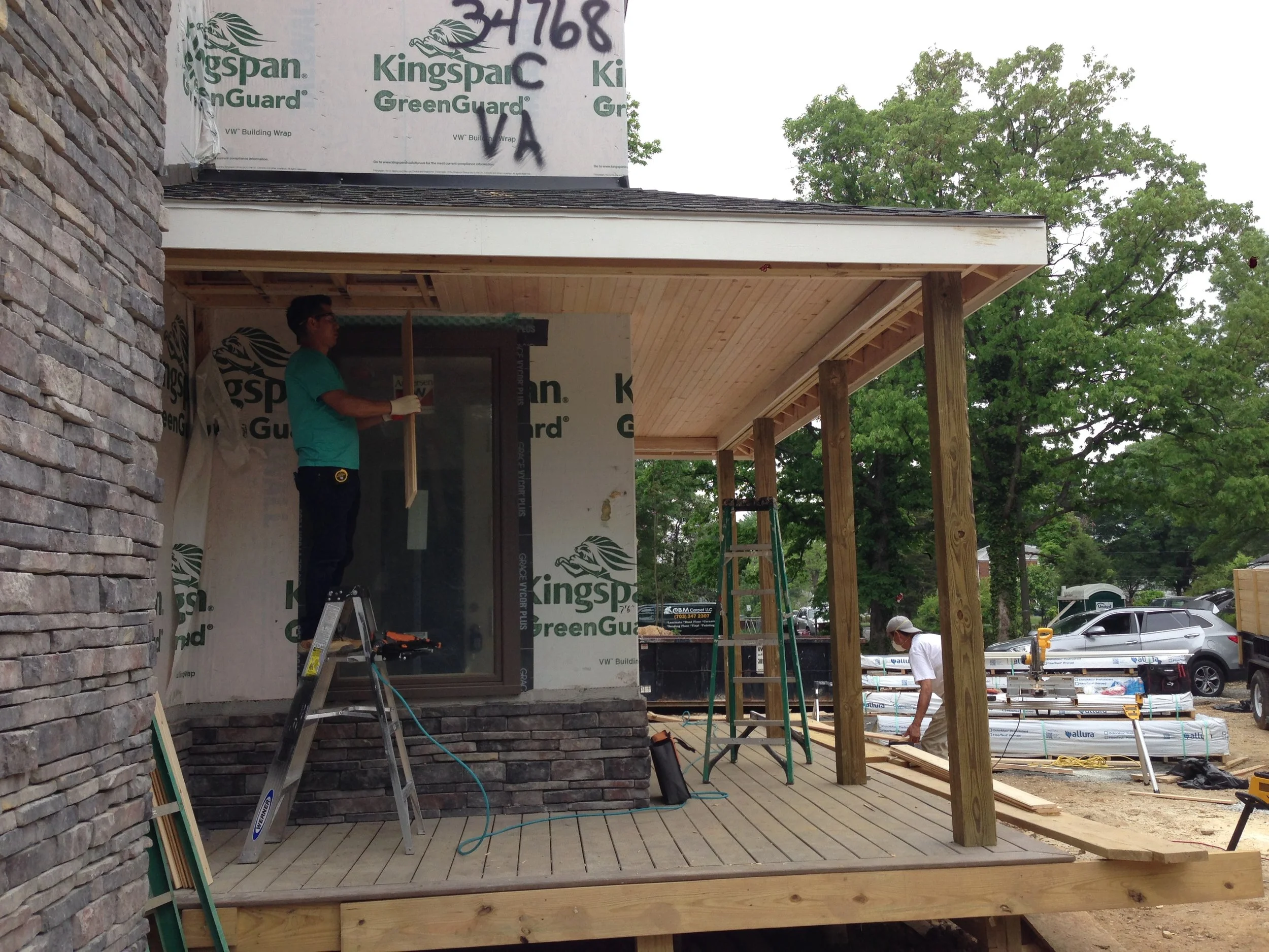 Jose installing the ceiling to the porch. Jose is a keeper. I love my big windows!