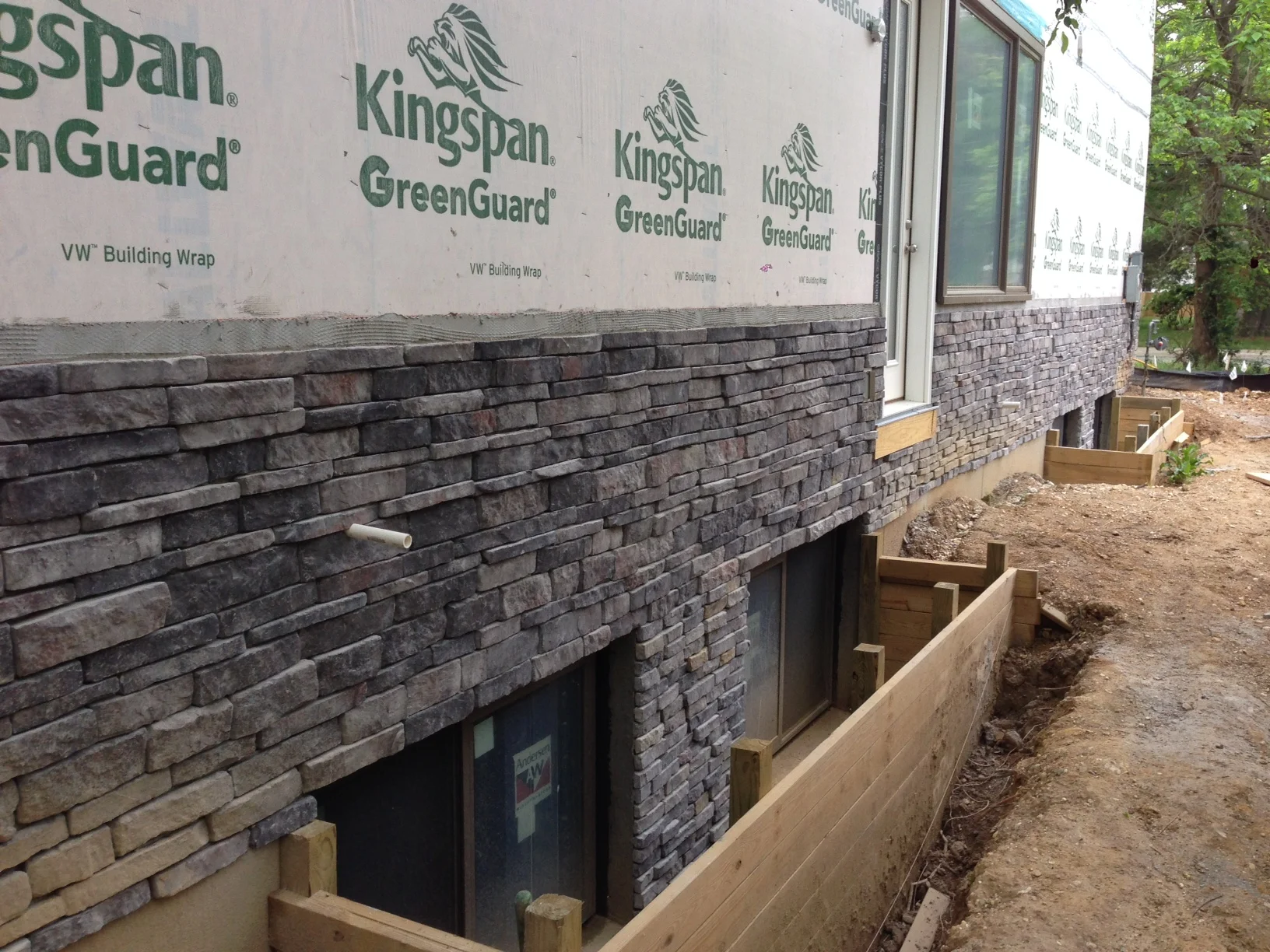 The back wall finished. They might need to add some between the window wells.