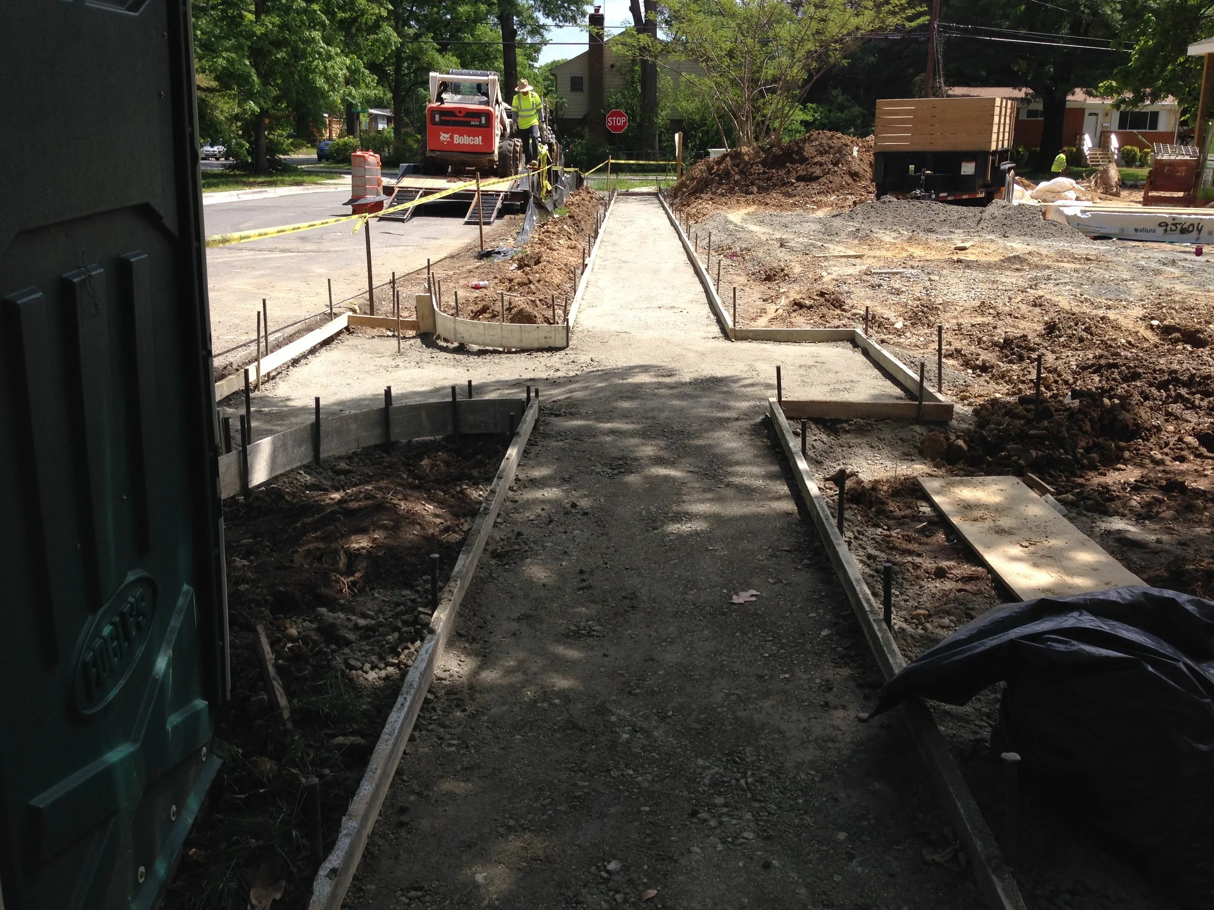 I returned in the afternoon to find all the form work in place and ready for concrete tomorrow. FYI our property will be the only one in our block to have a sidewalk. The Sidewalk to nowhere but here. 