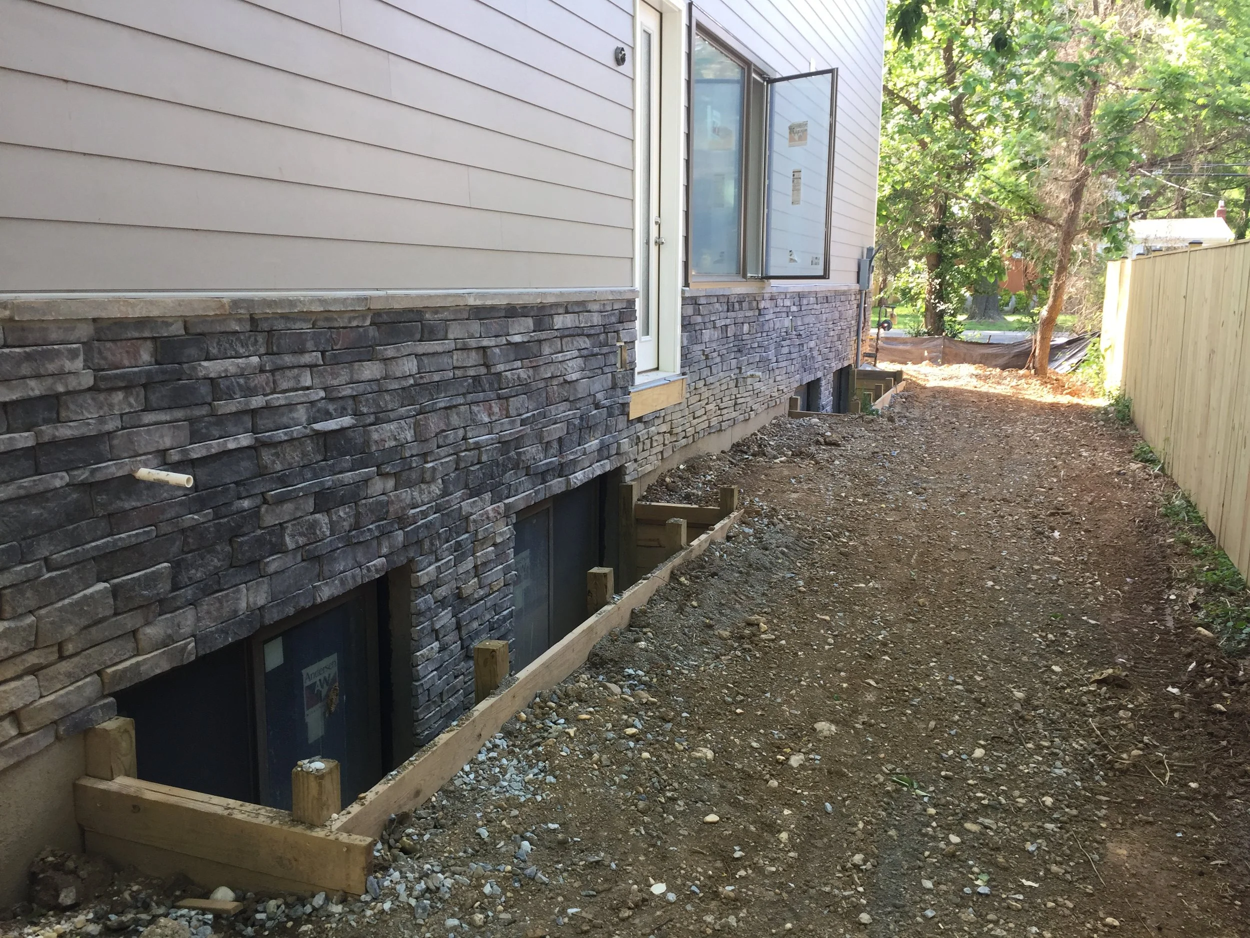 Finally Jose finished backfilling the side yard. The post still bends in a little but we will call it :character"