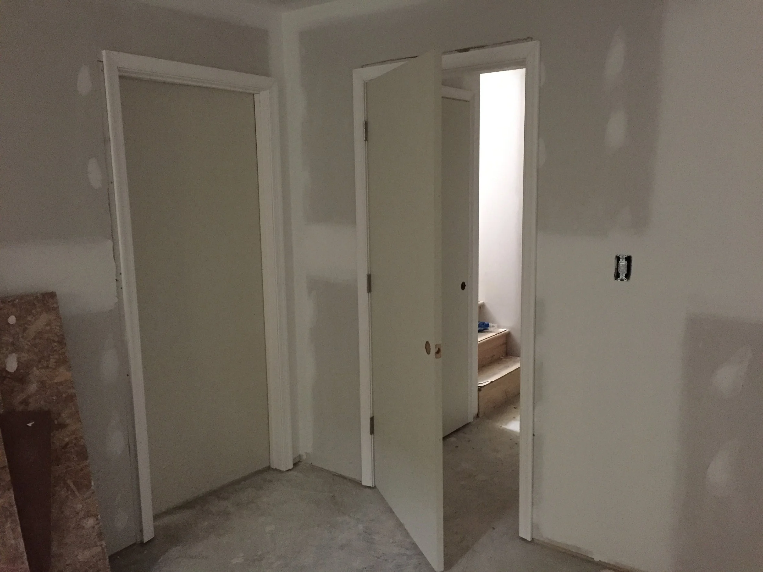 Doors installed. I also realized that I now need door knobs! More money. My next home is going be on the beach with 75 degree weather year round and I'm only building a platform with a roof. No walls or doors or windows. Just an open space and that is it. Pee in ocean and cook on a grill. 