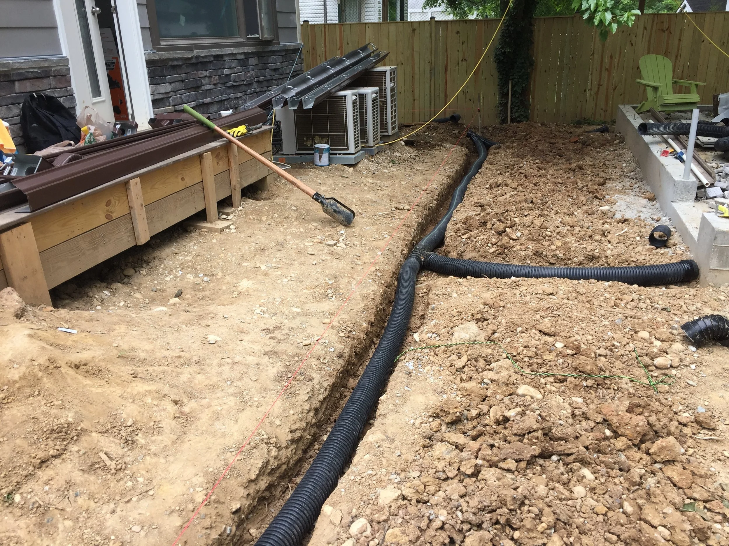 The ADS N12 pipe with 1/8" per foot slope. This is the high end. Additional dirt will be placed here during final grading. 