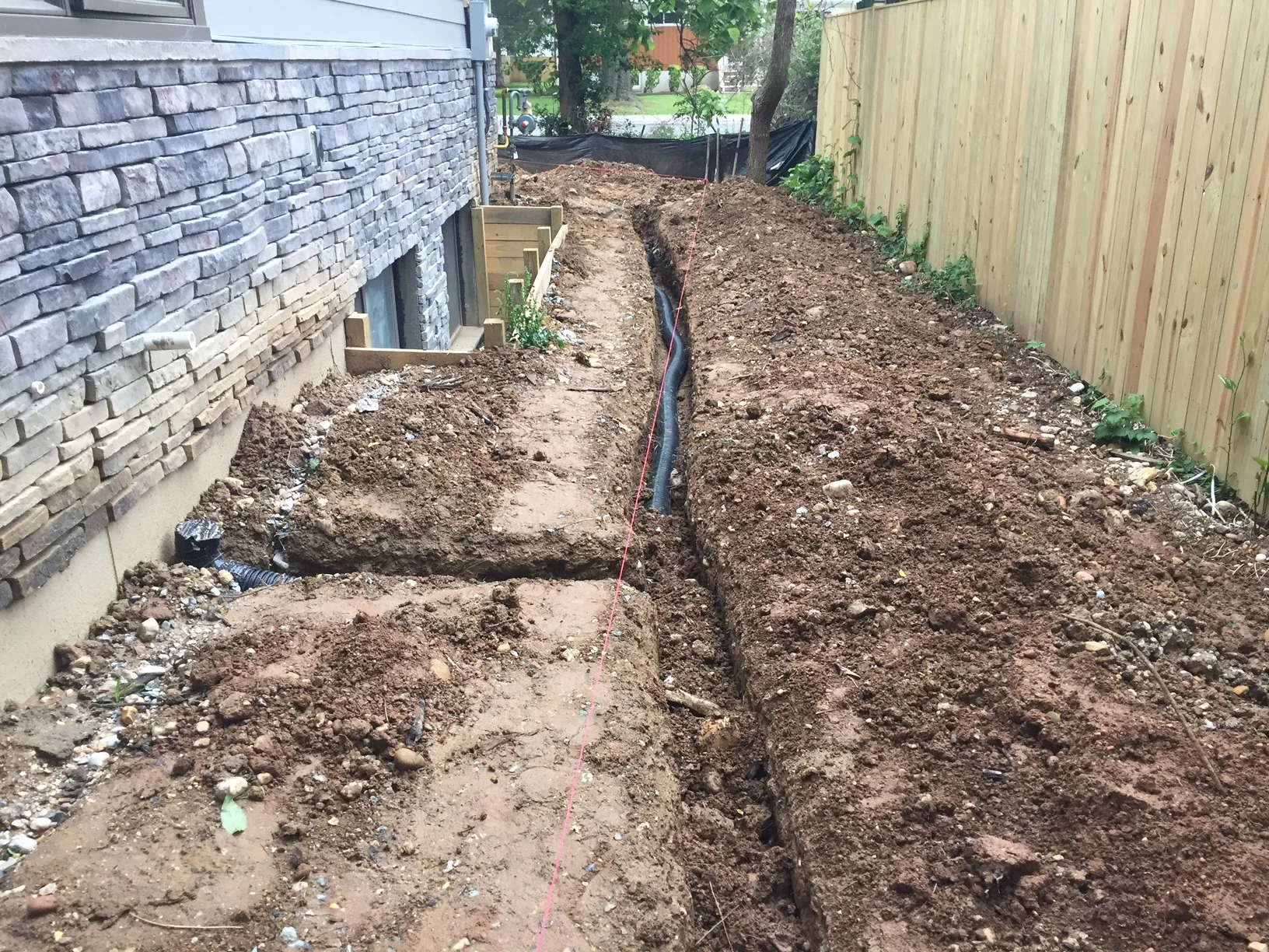 The good thing about having the water drain directly to the storm drain is that the yard will not fill up with mudd. 
