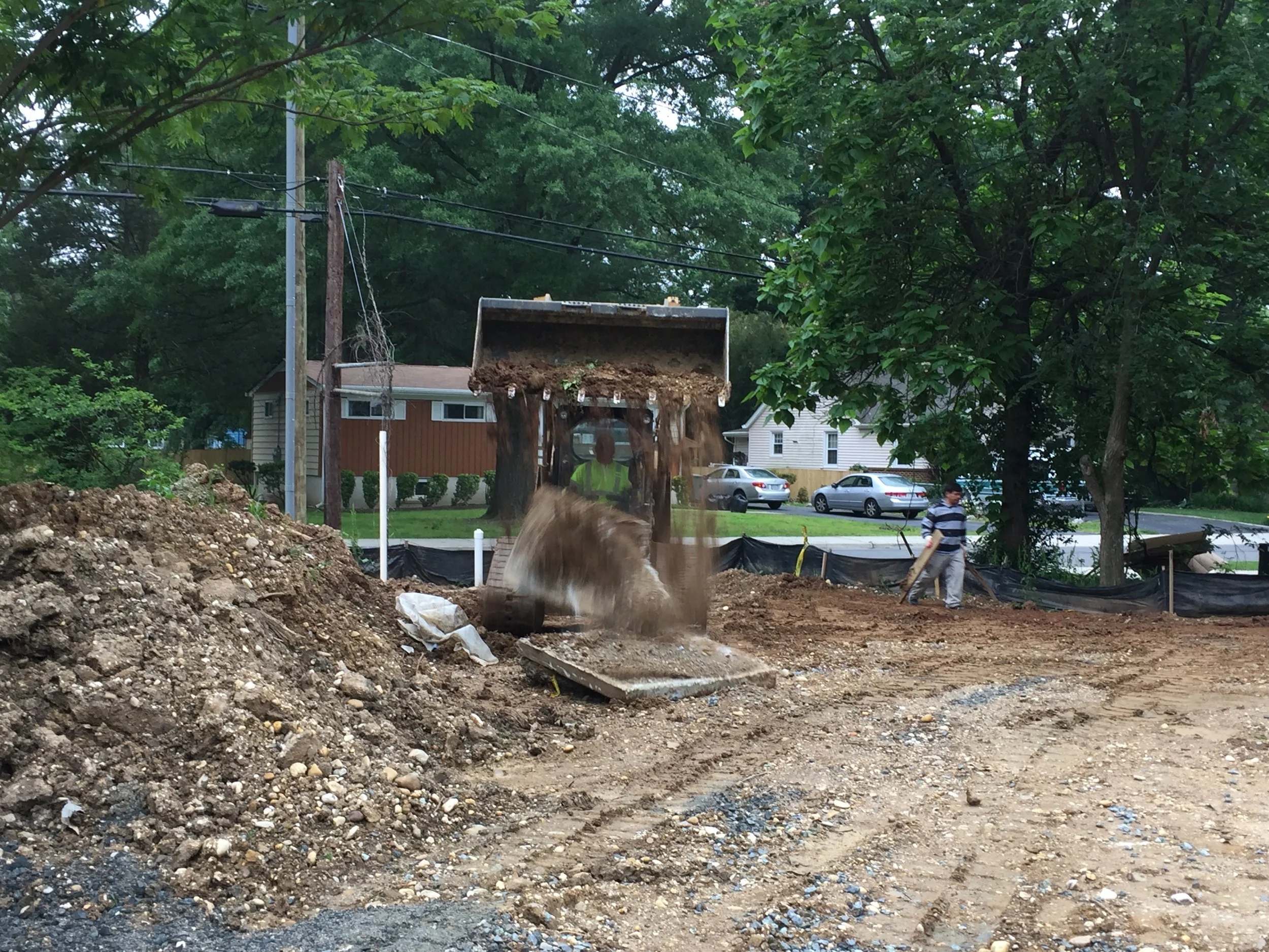 Cleaning up the site before final grading takes place. They had a few big concrete sidewalk portions that had to be destroyed to put into the dumpster.