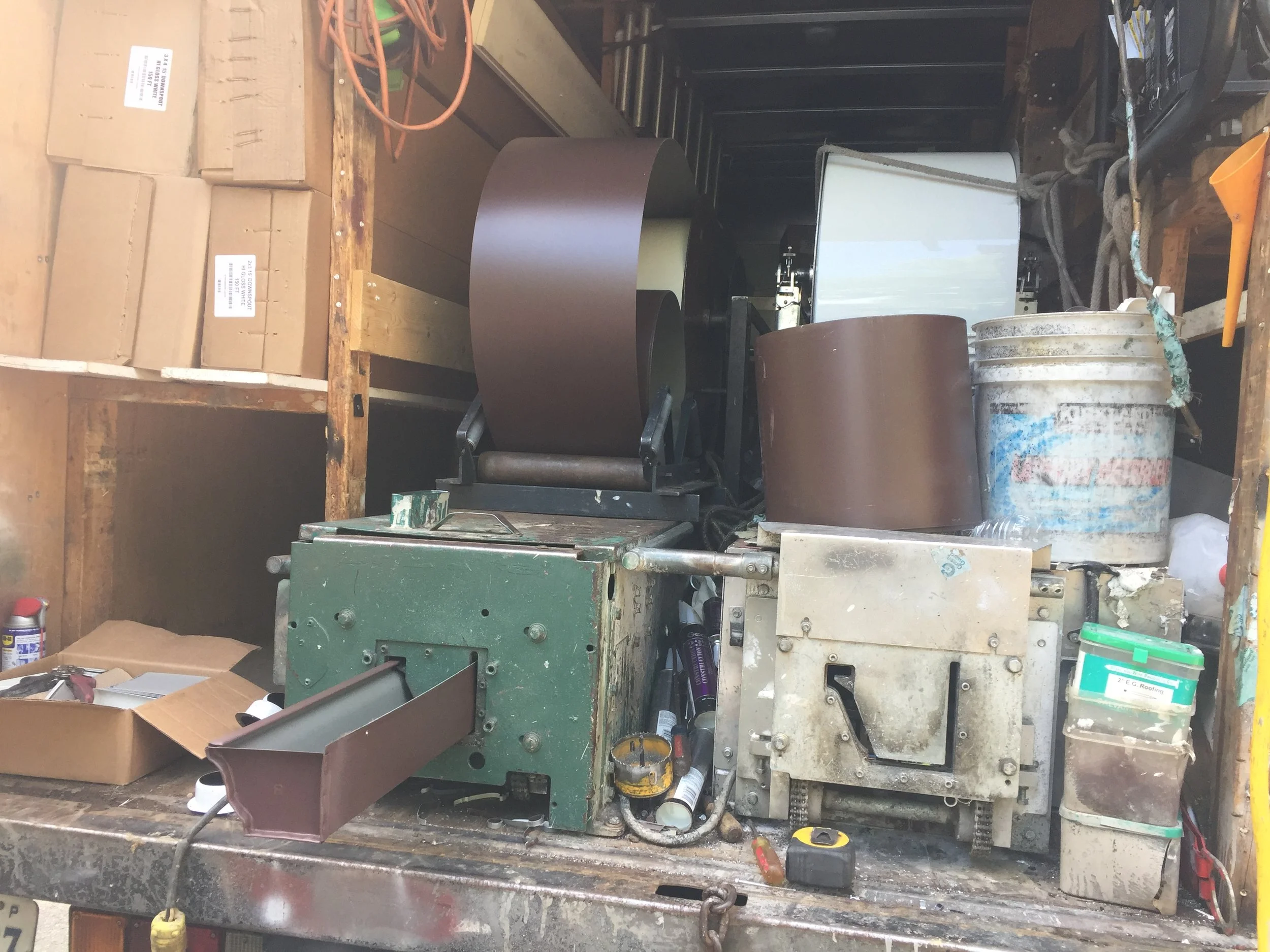 What you see there is a gutter making machine. It can make a gutter as long as needed. This way there are no seams every 10'-0" and looks much cleaner. 