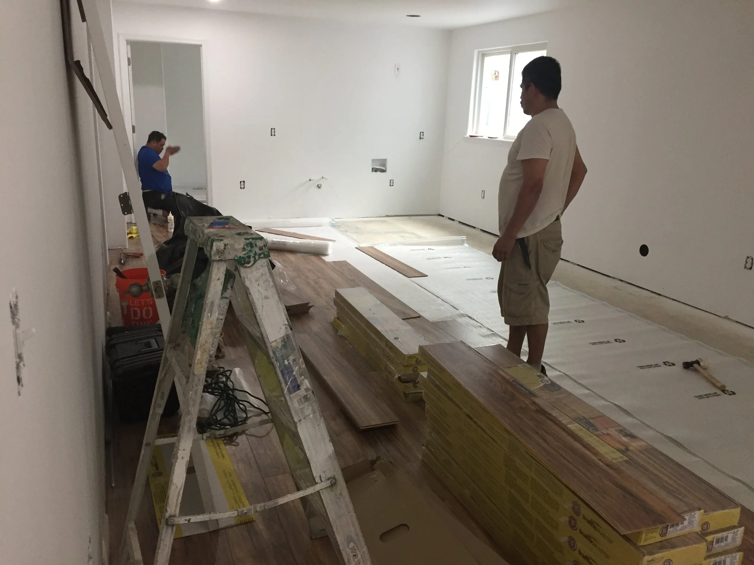 Basement flooring being installed.