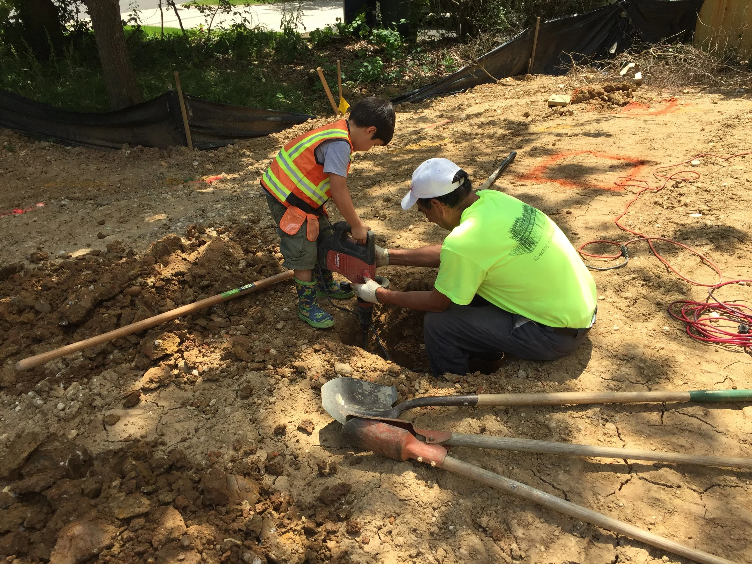 Pedro helping the deck installer while using a automatic shovel digger or something like that. All I know is that it dug dirt quick!