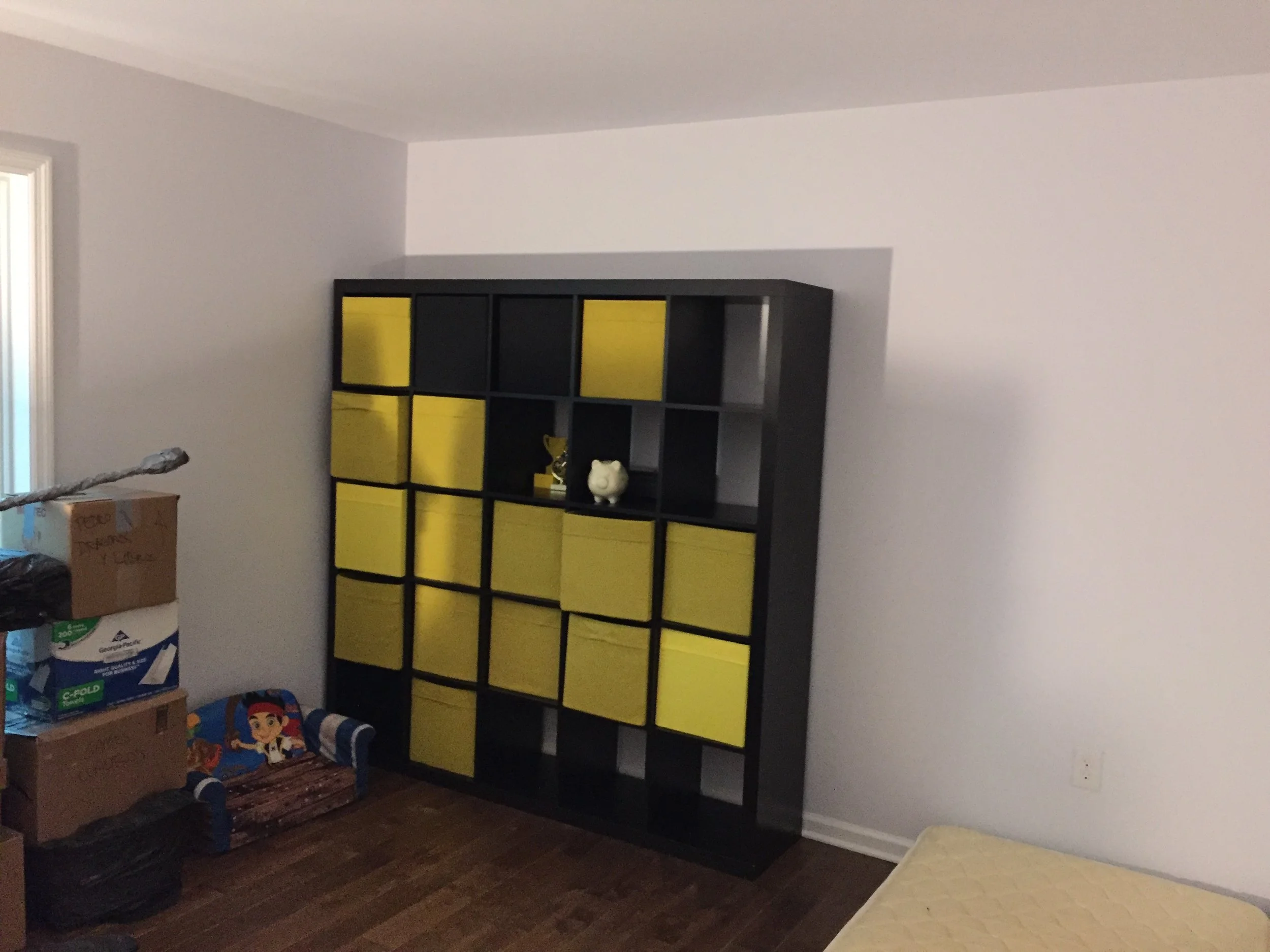 The famous IKEA shelving slowly getting filled up with a bunch of stuff. A bunch of it. 