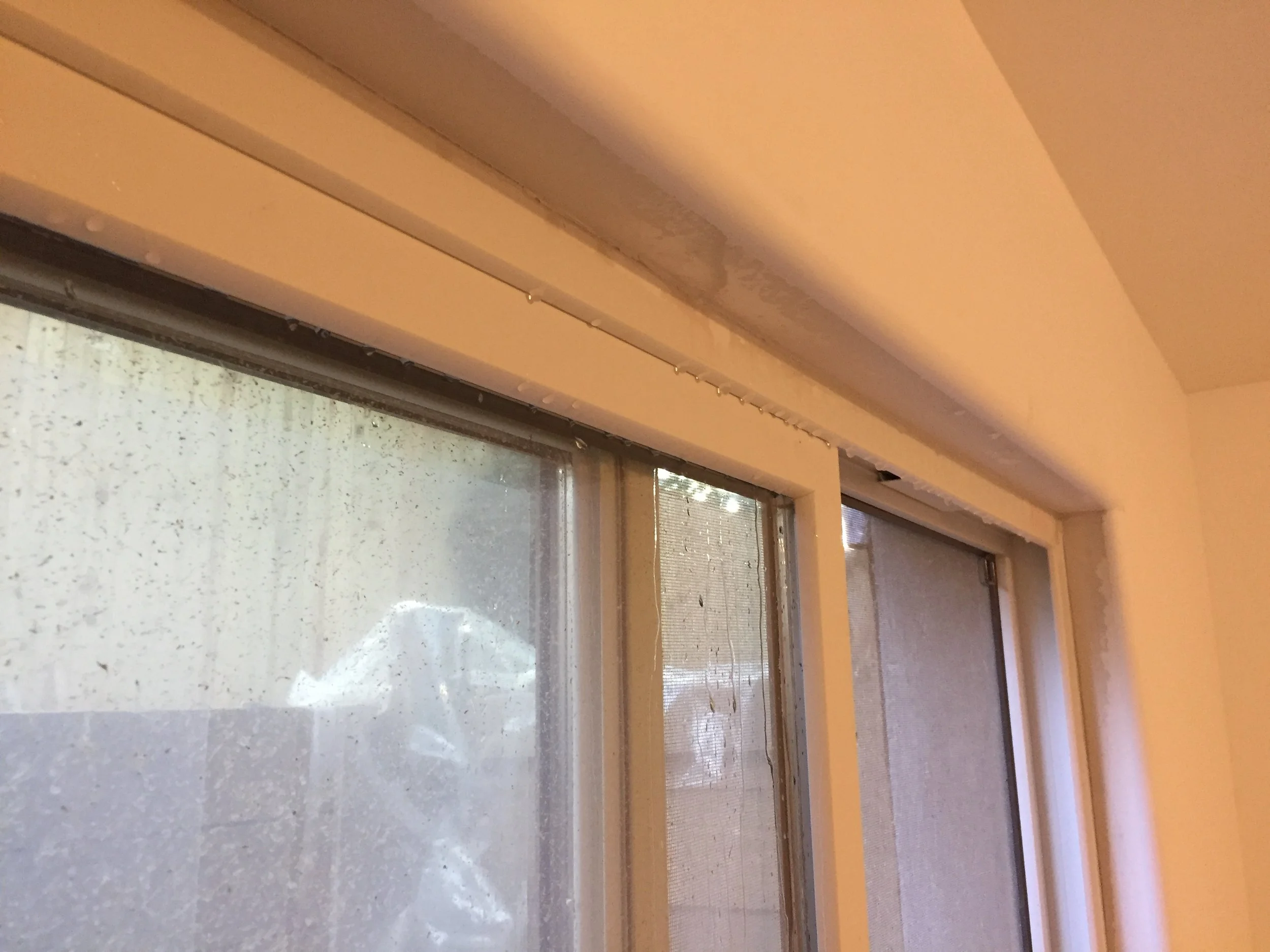 Water dripping from the top of the window. Where is it coming from?