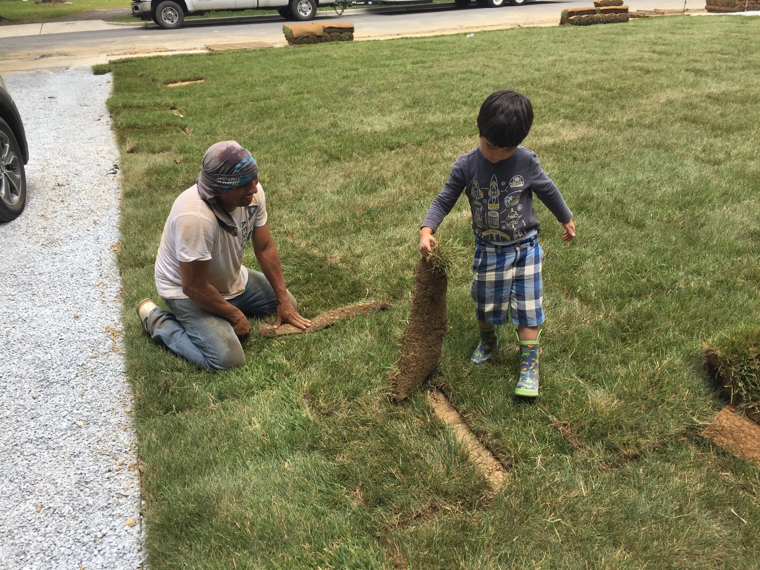 Pedro was enthralled with the process. He sat observing for a good 30 minutes before he decided to get out there and start covering the strips with one of the workers. He worked with the guy for a good 45 minutes. I love the fact that Pedro likes to get dirty outside.