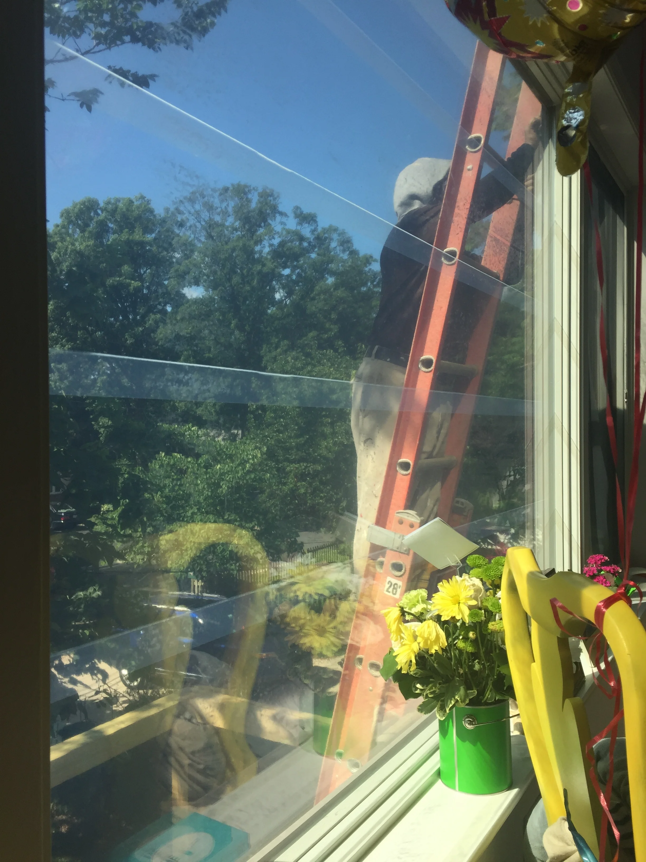 Rudy removing the last piece of plastic from the windows. This felt good!