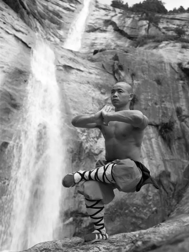 SHAOLIN MONK PRACTICING ONE LEG SQUAT AND MEDITATION. 