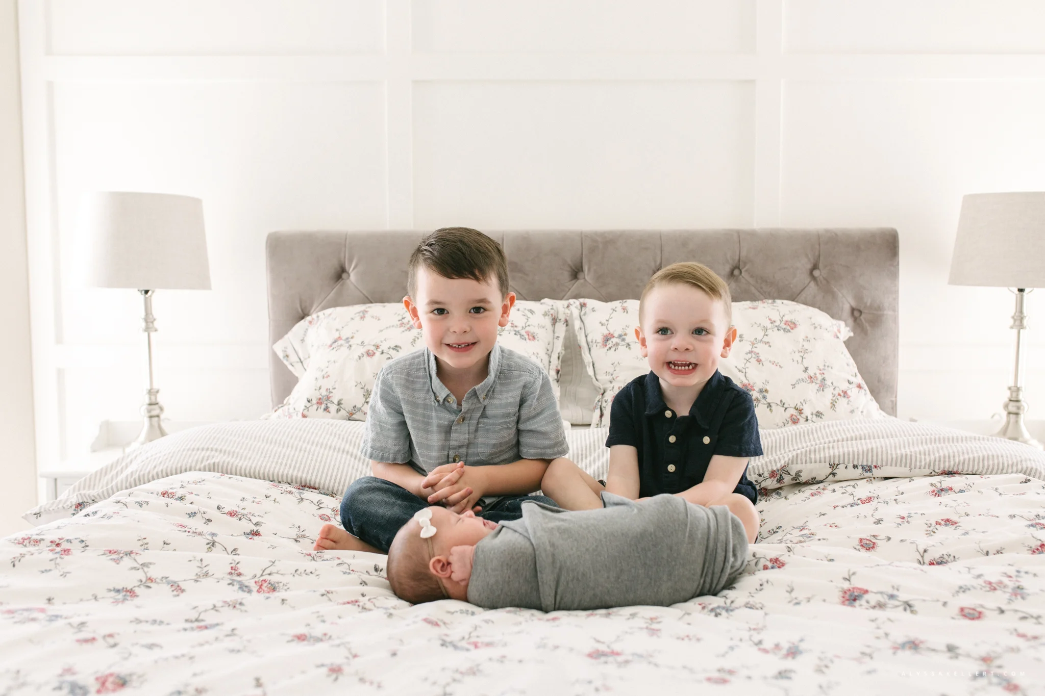 brothers with baby sister on bed vancouver