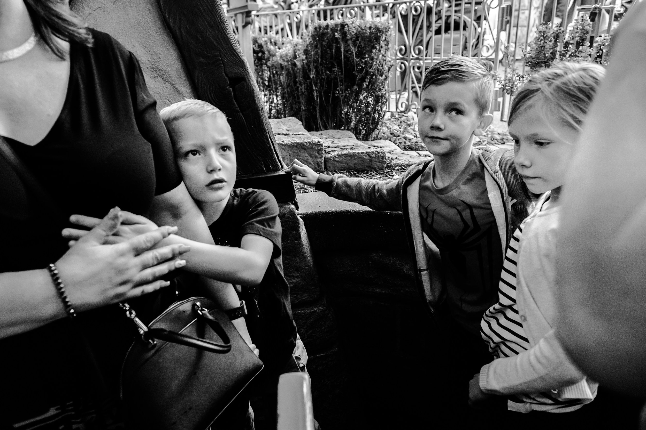 kids making expressions while waiting in line vancouver documentary photographer