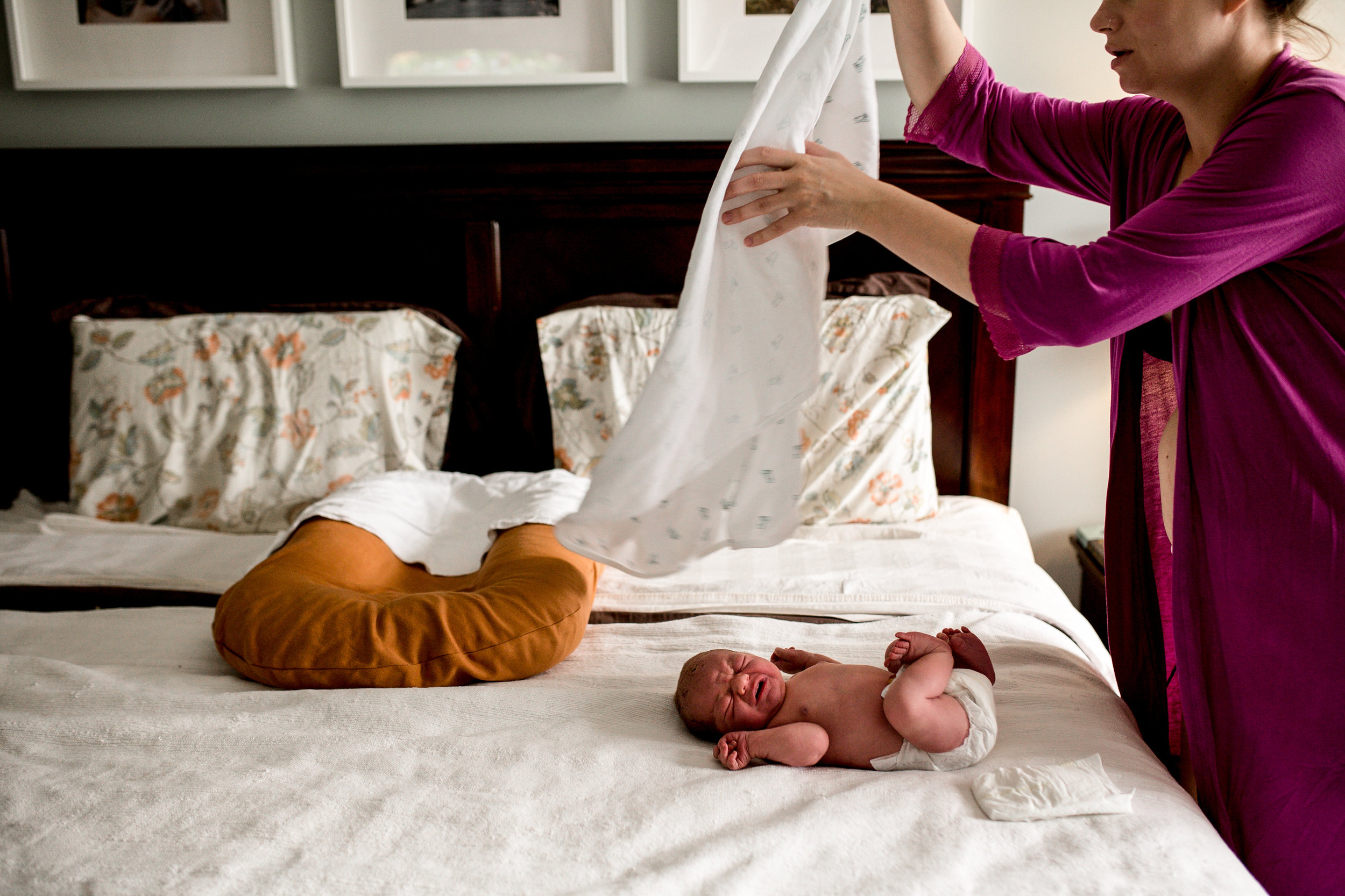 mom-putting-blanket-on-newborn.jpg