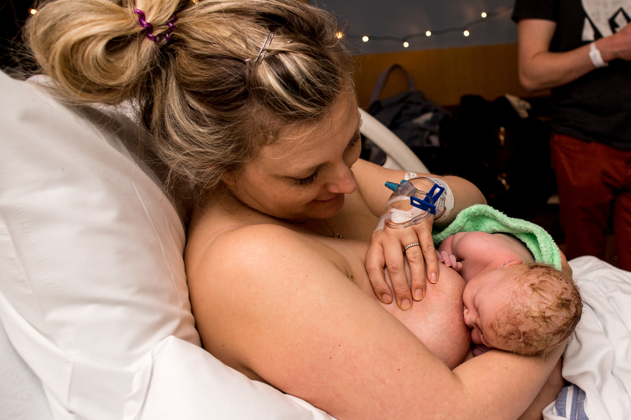 new mom breastfeeding her baby for the first time