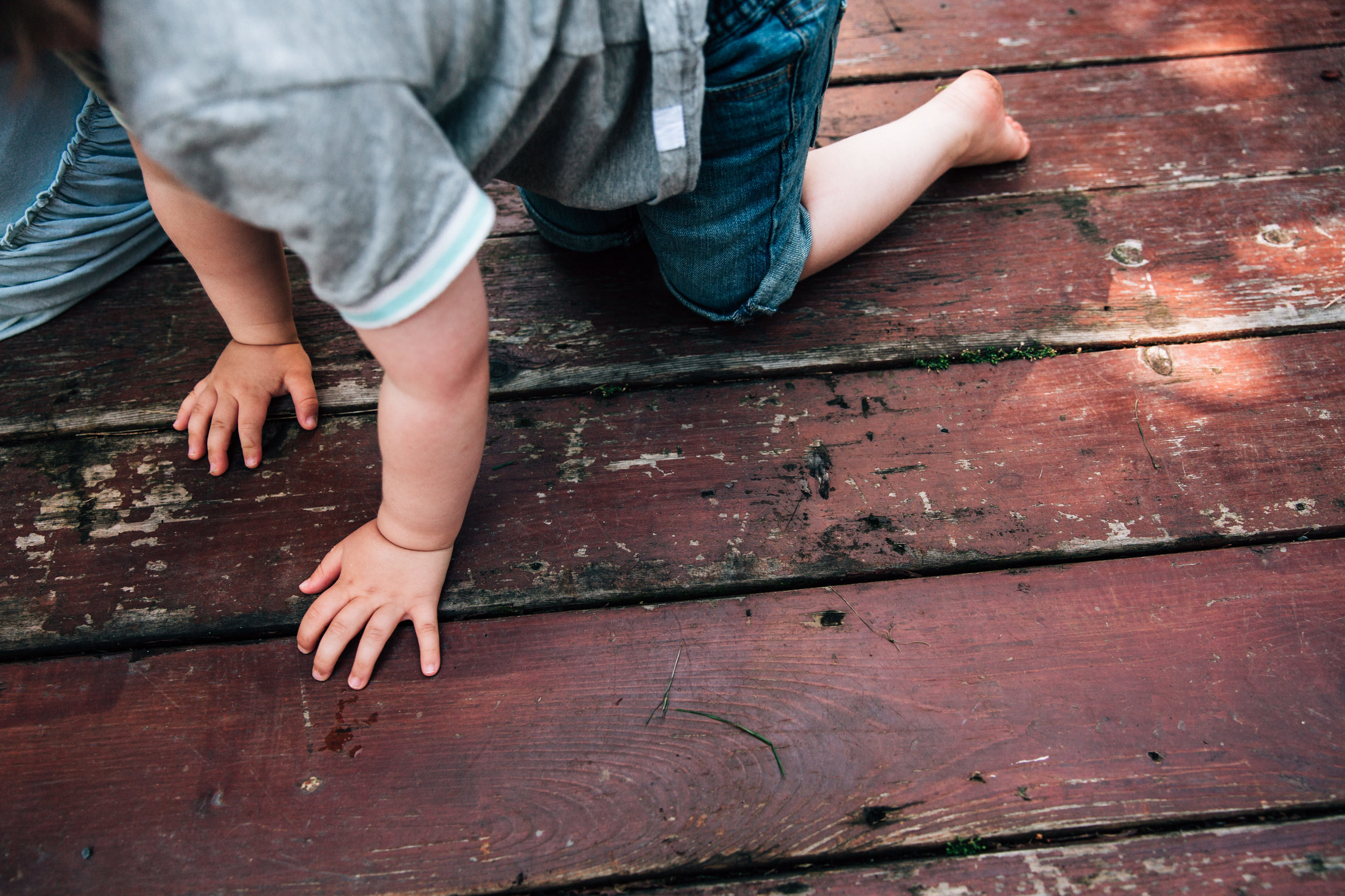 toddler climbing limbs