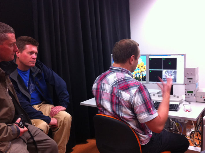 Mr Steve Moody explaining to artists how the c omputer controlled scanning electron microscope (SEM) functions.