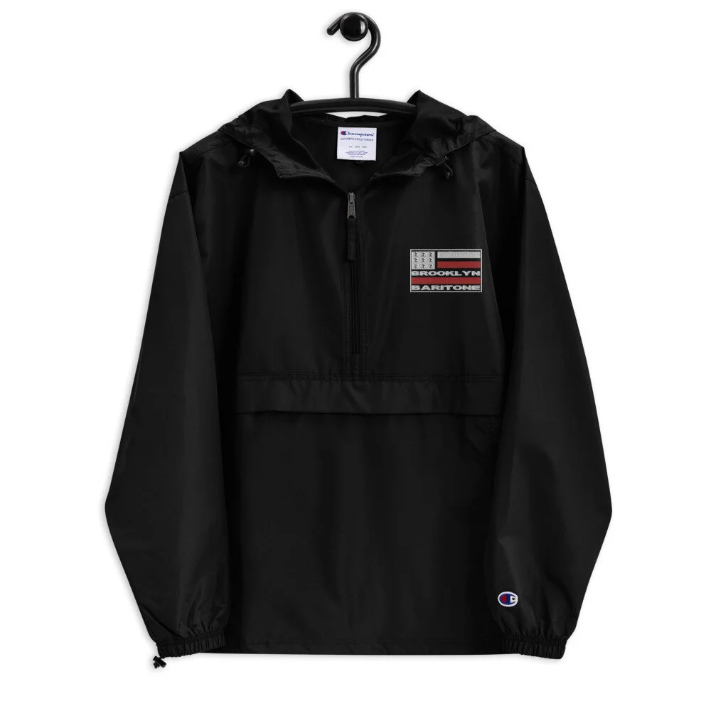 embroidered-champion-packable-jacket-black-front-6021418a94d7d.jpg