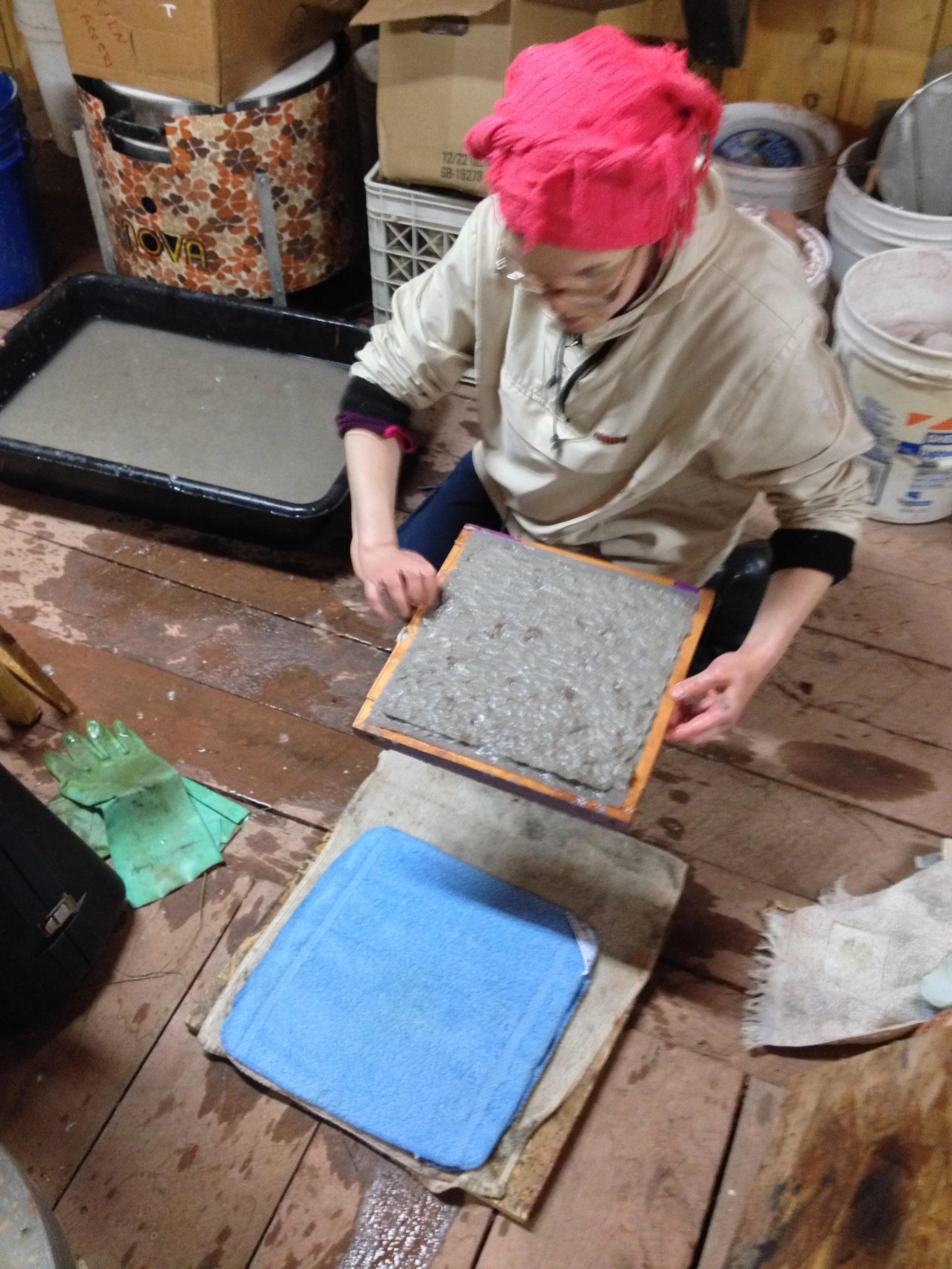 Mari making handmade recycled paper