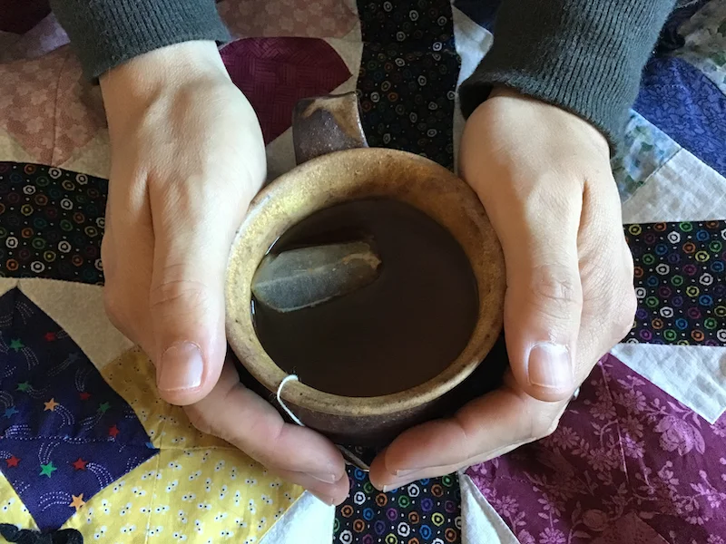 Jane Gordon warms her hands with a hand-made mug