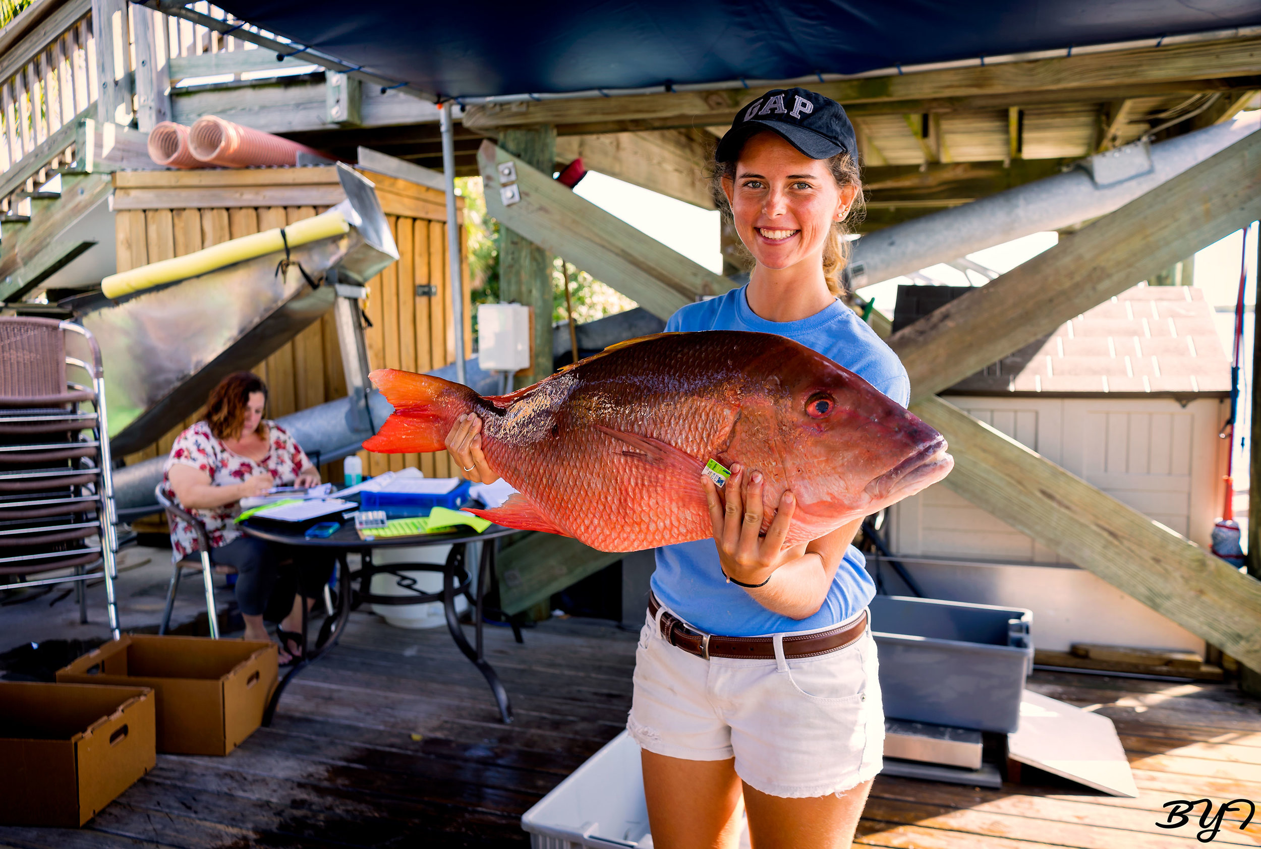 Erin Grebenev holding up a mutton snapper.