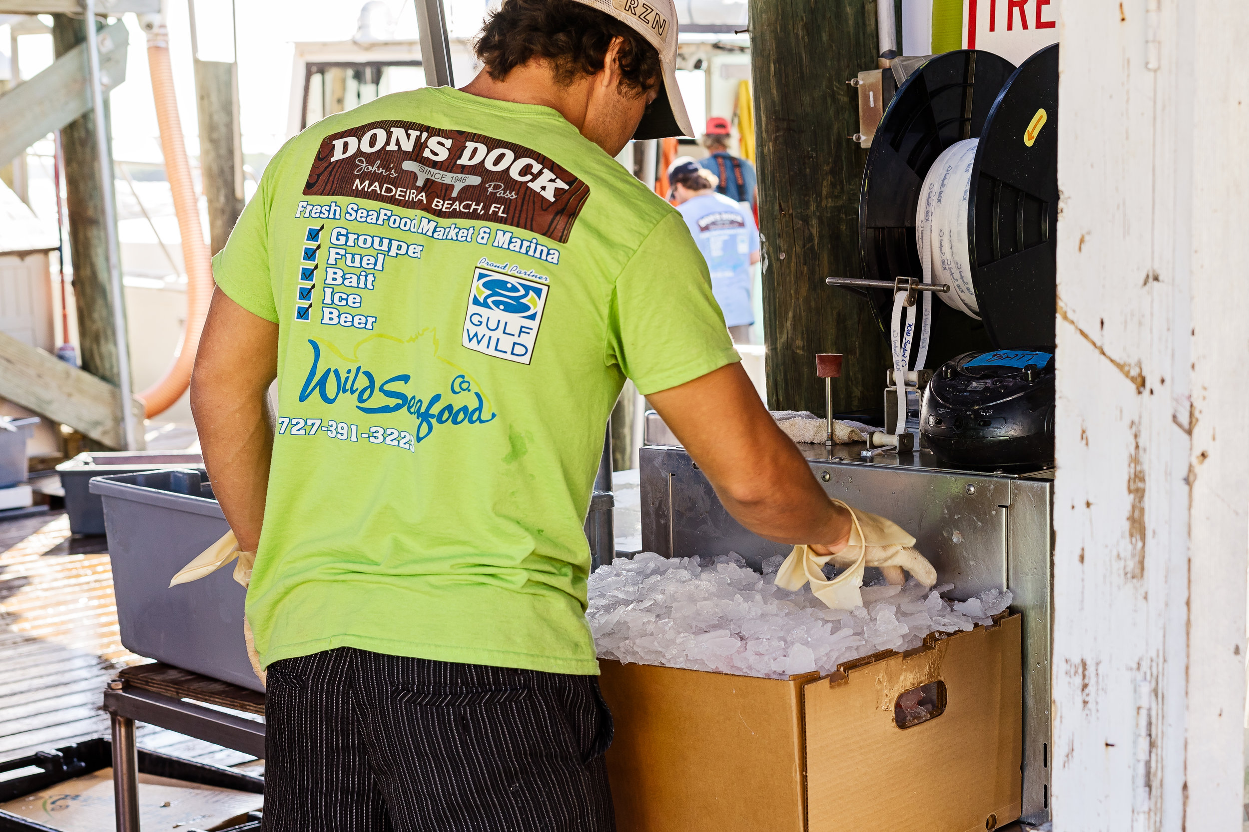 Cody Tibbitts prepping fish for shipment.