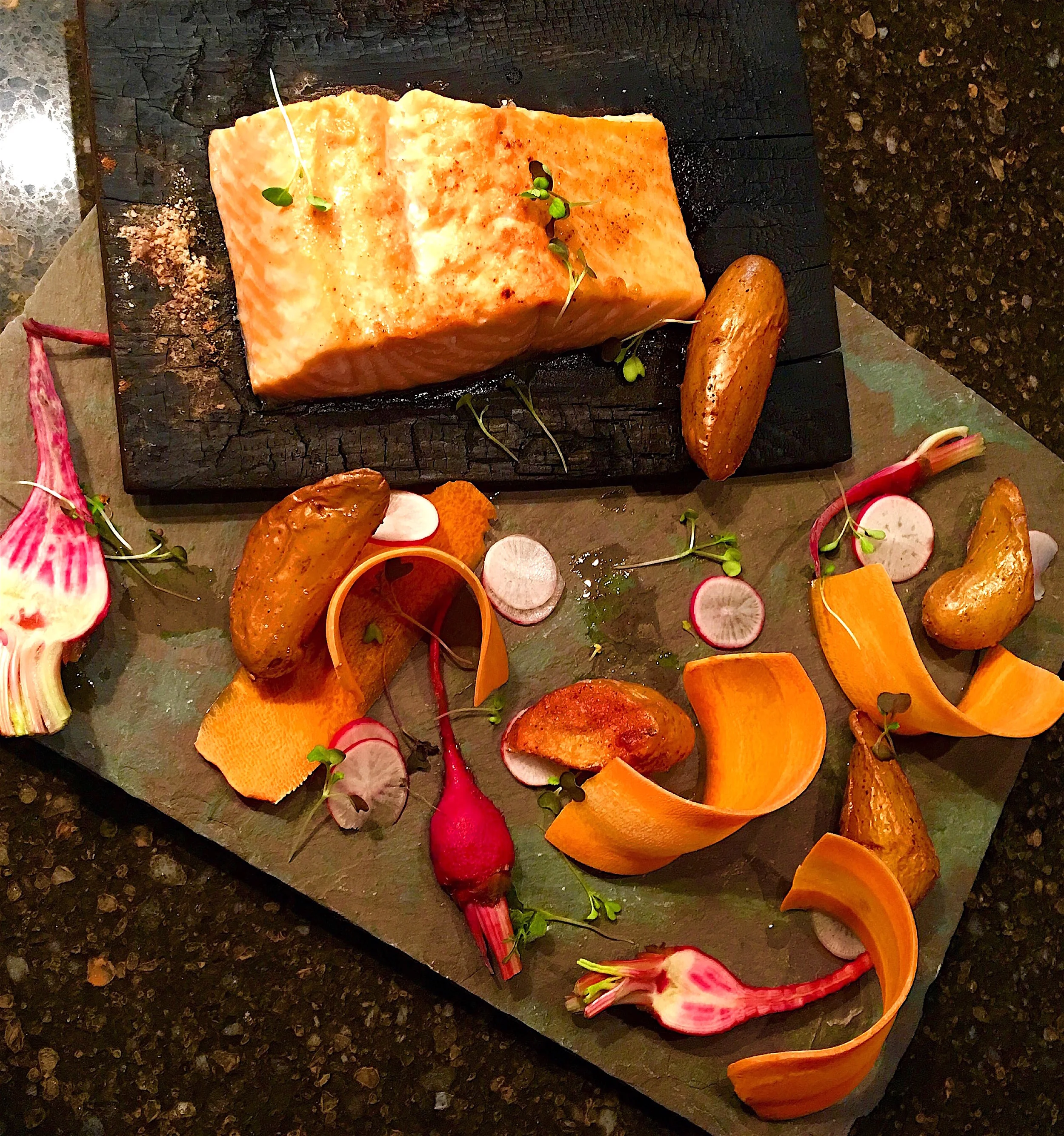 Salmon on a cedar plank and crudités. New Year's Eve Dinner