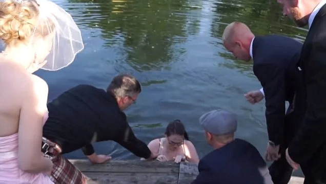 Wedding Photographer Slips and Falls Into Lake During Recessional 