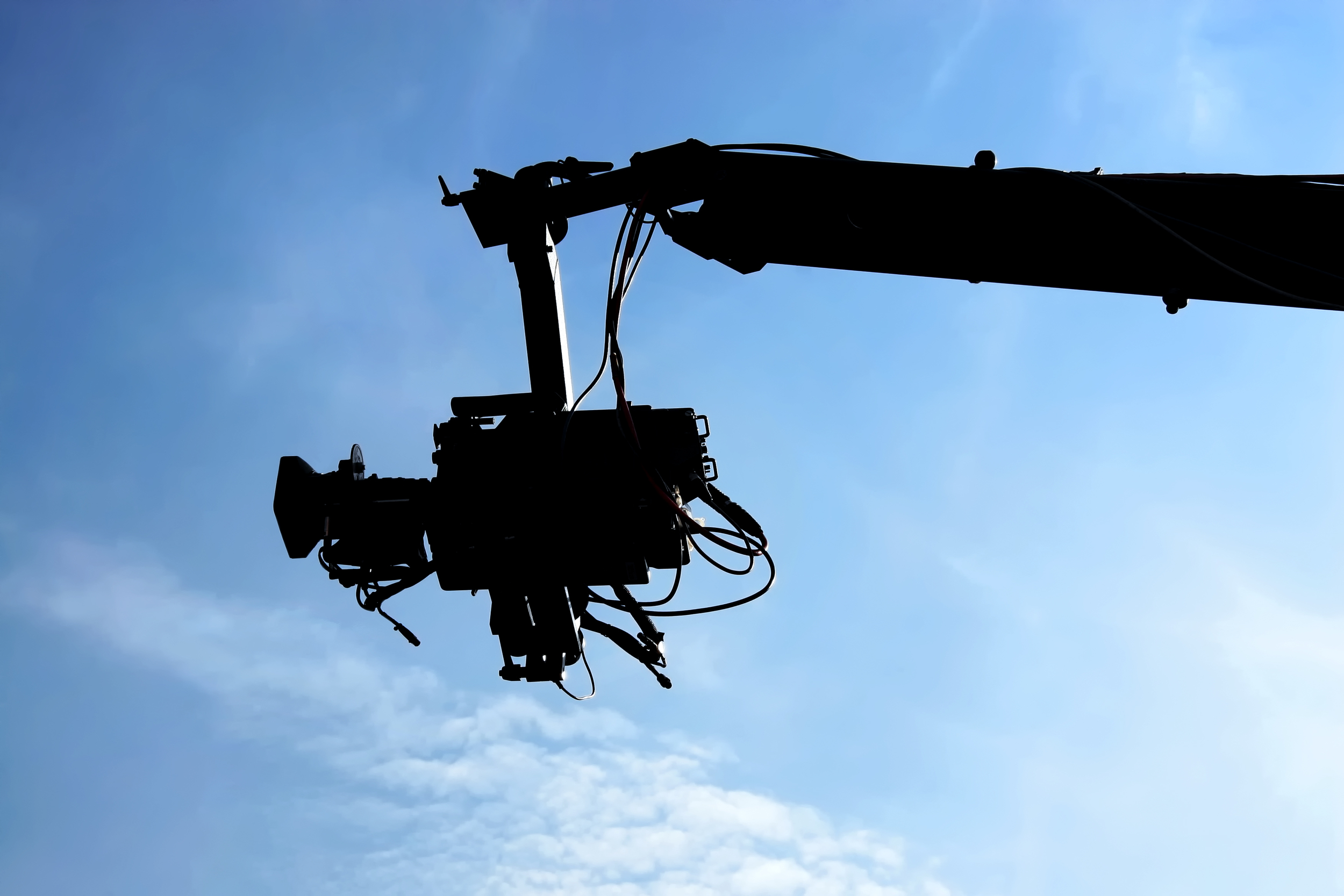 038129932-tv-camera-against-blue-sky.jpeg