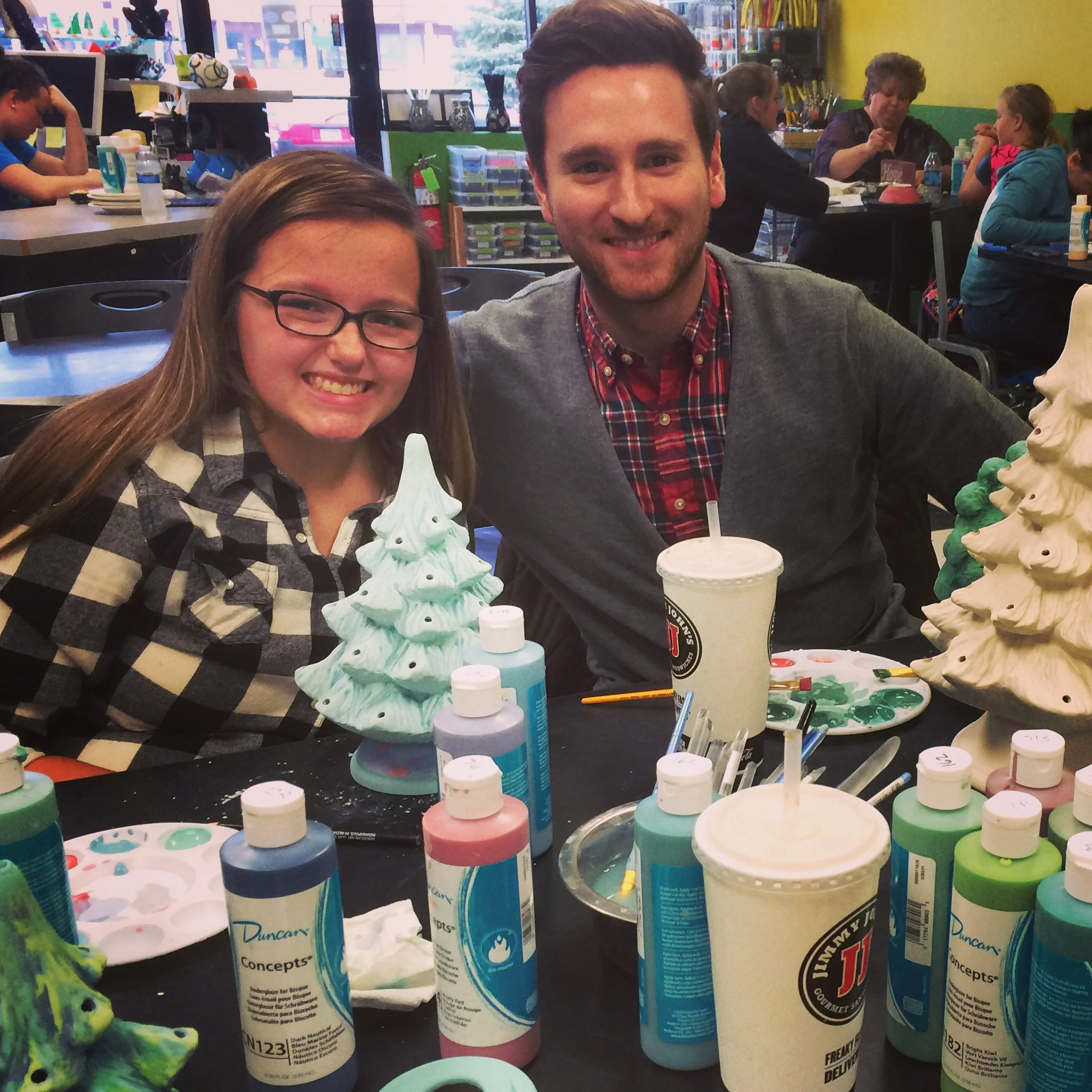 Jon and Alisha happy with their finished products - notice Jon's untouched white tree. He is very proud of it.