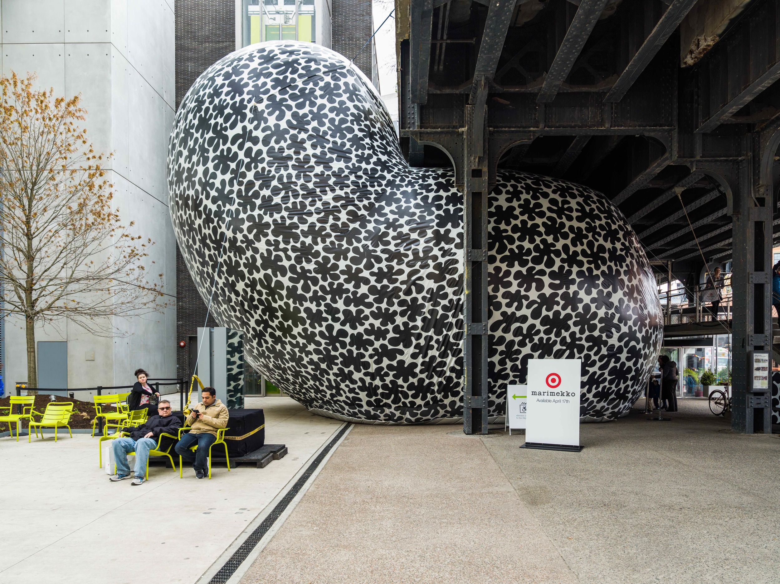 Koppelo Pouf is an asymmetric world covered in black and white dots. Guests lie on large memory foam forms beneath a mirrored ceiling. Surrounded by the Koppelo pattern, they snap their image in the mirrors hanging from the ceiling.
