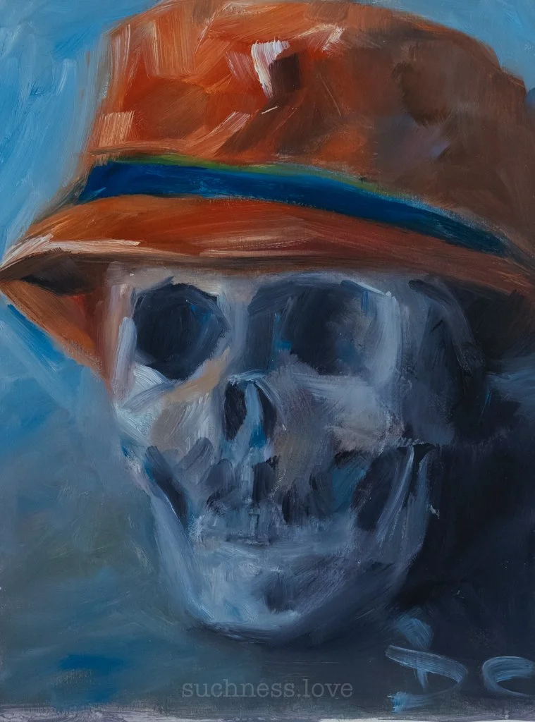 A painting of a human skull wearing an orange hat with a blue band, set against a blue background.