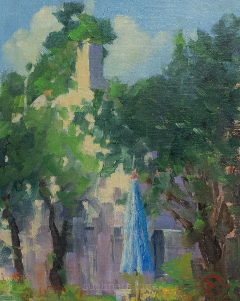 Impressionist-style painting of a backyard scene with a stone wall, lush green trees, and a blue patio umbrella.