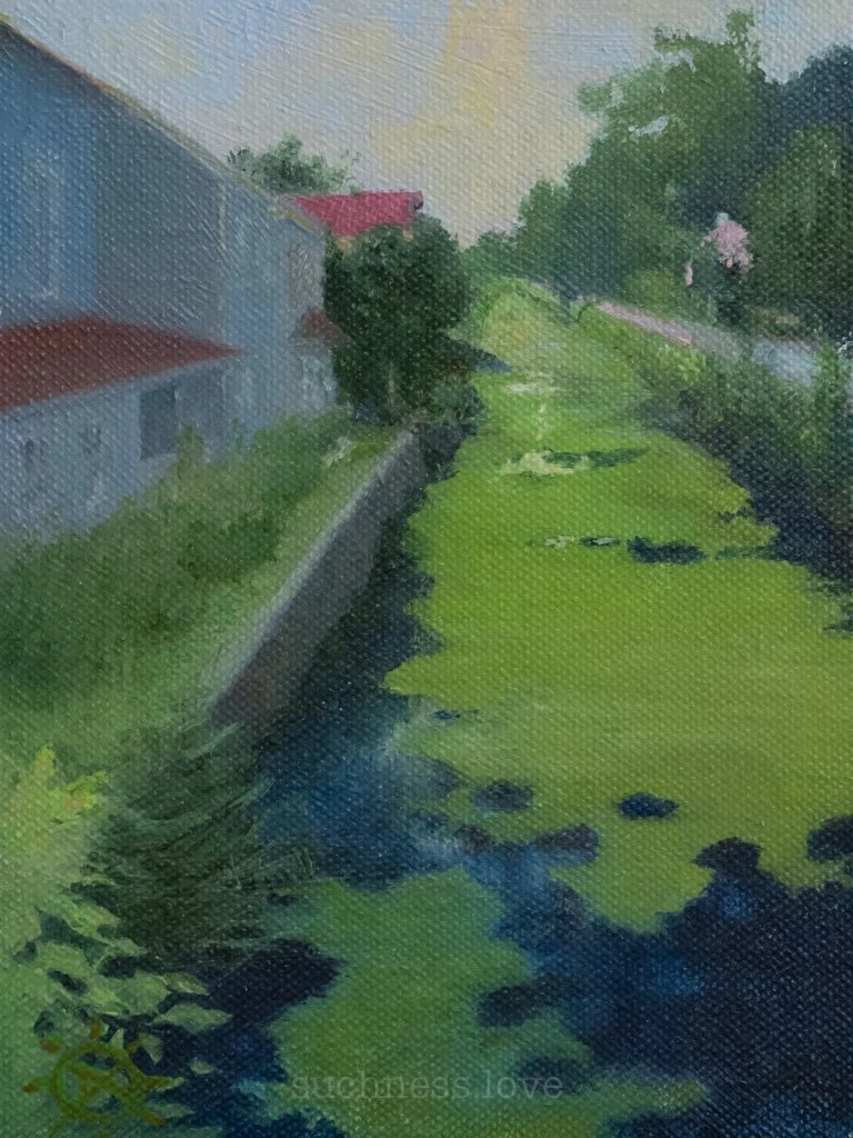 A painting of a small river or stream flowing alongside a grassy area with trees and a building with a red roof in the background.