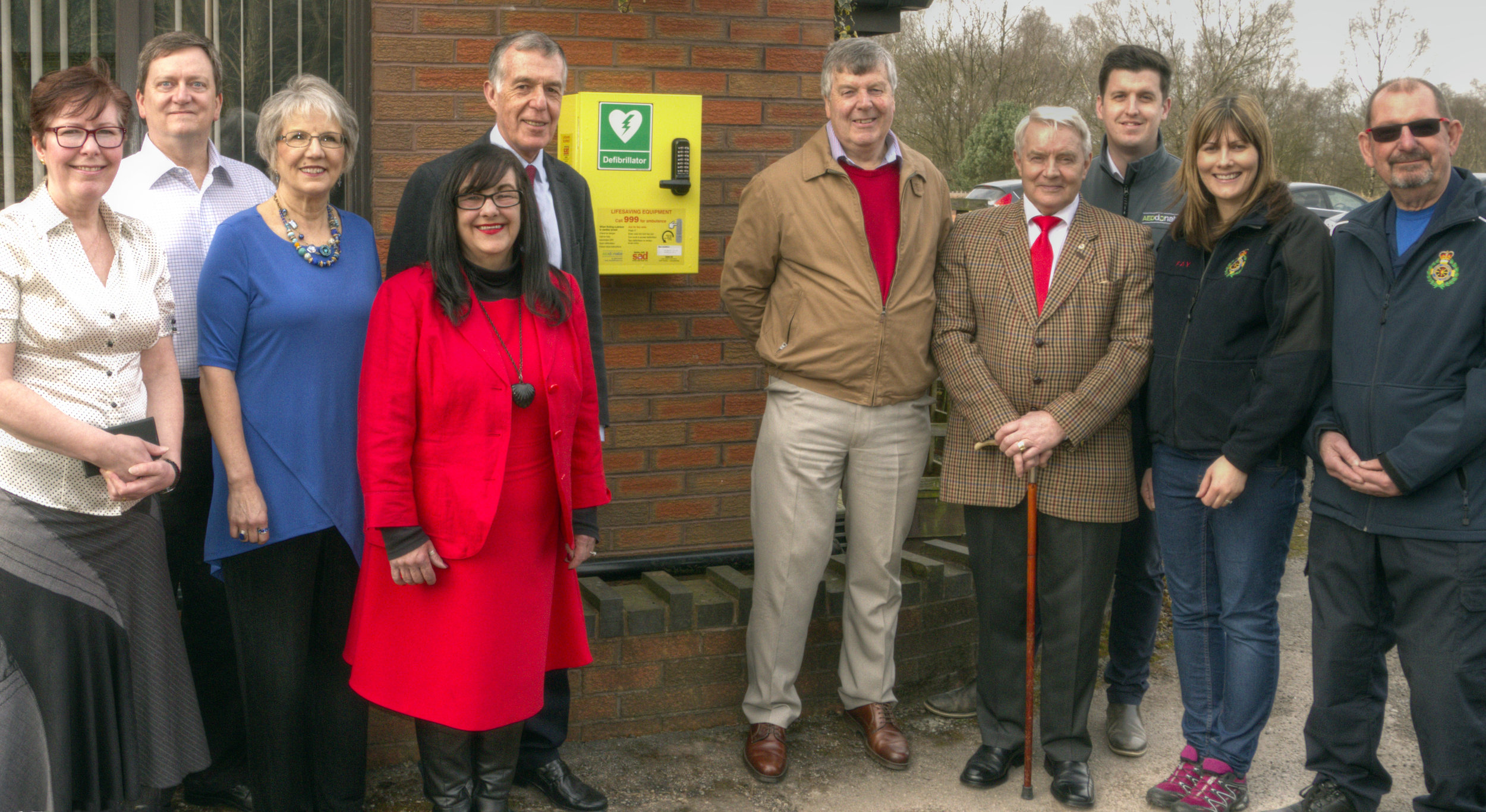 From left to right: Trudy Williams (Clerk to Brindley Heath Parish Council), Robert and Debby Lugar (One Another Ministries), County Councillor Mrs Christine Mitchell, County Councillor George Adamson, Councillor Paul Adams (Chairman of Brindley Heath Parish Council), District and Parish Councillor Alan Pearson, Jamie Richards (Head of AEDdonate), Fay Cooper (Rugeley and District Community First Responders) and James Shuttleworth (Rugeley and District Community First Responders)