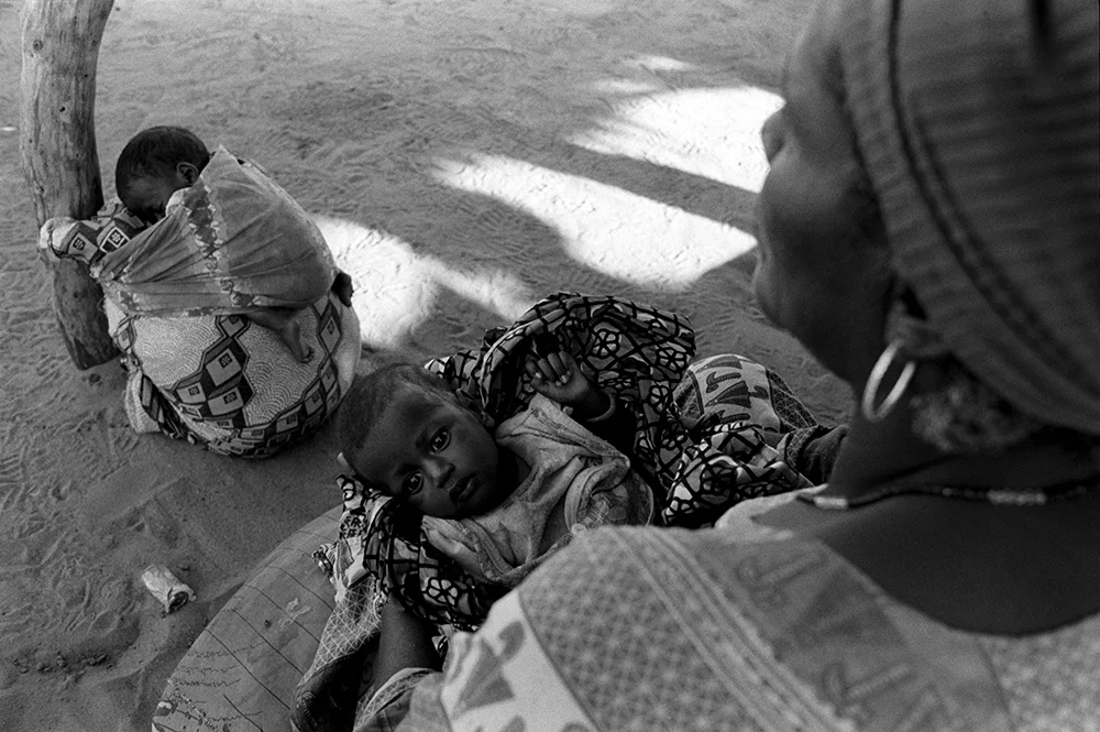 Husseina (tied to a cushion) and Hussaina (in her aunt’s lap), both 40 days old, Niger 2005