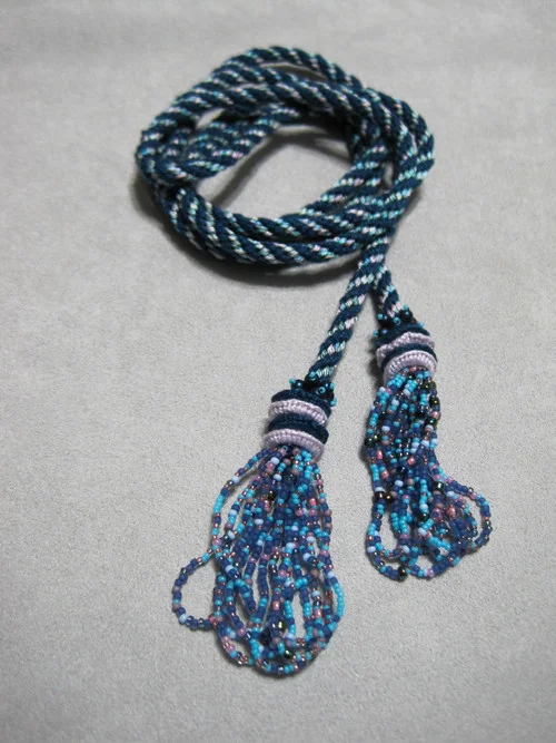 Cordelia Lariet A great beginner kumihimo project. Multiple colorways are available. Skill level beginner. Cost $25.00 plus supplies. Required kit is $15.00. Additional supplies are also required.