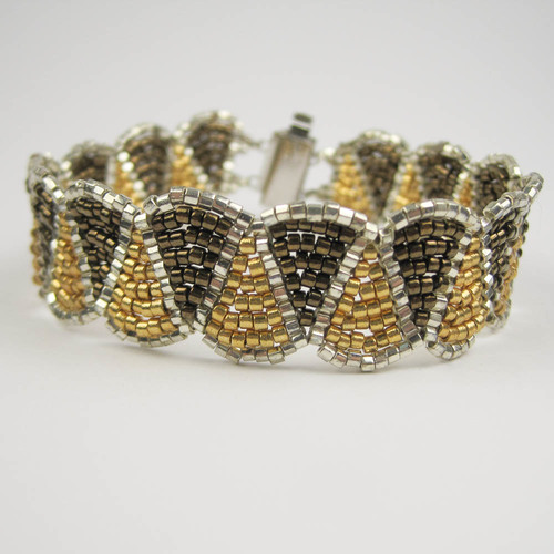 Wiggle Bracelet Pattern by Deb Roberti of www.aroundthebeadingtable.com, taught with permission. A variation on brick stitch is used to make this versatile and bracelet. Make it elegant or casual simply by changing the colors. Skill level advanced beginner. Cost $25.00 plus supplies.