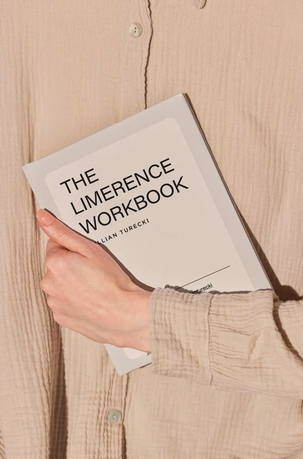 A person holding The Limerence Workbook