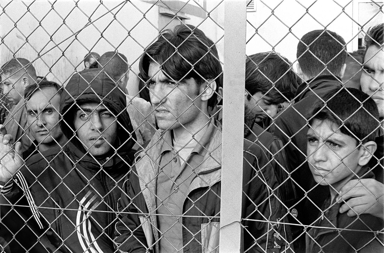 Immigrants in detention courtesy of Wikimedia .