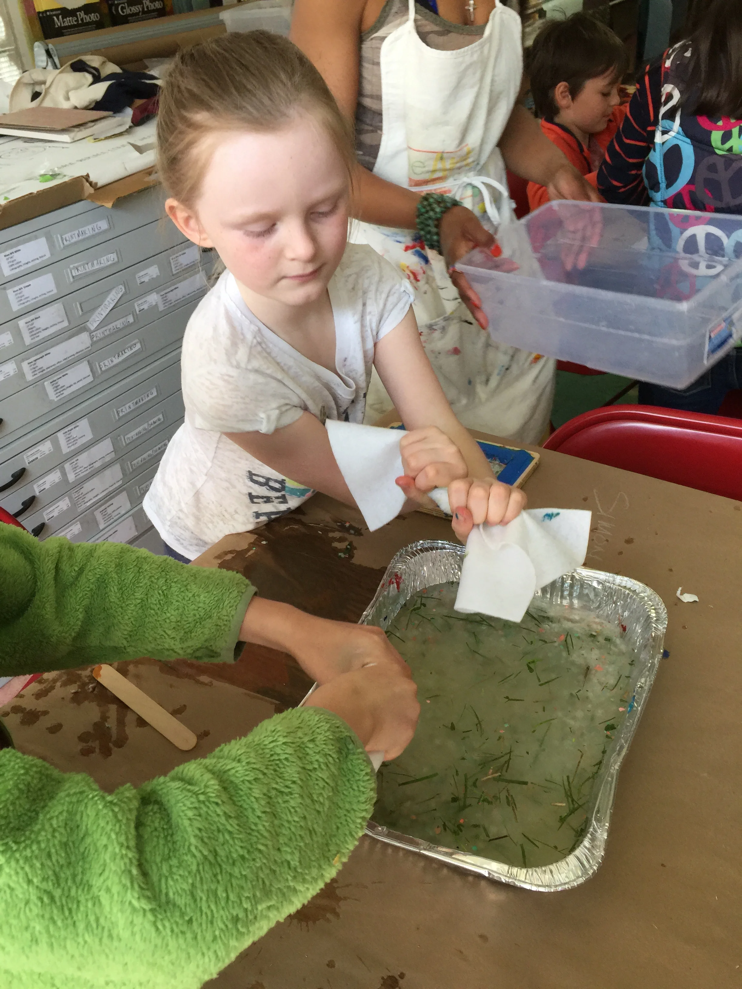 Squeeze!! Artist Claire is showing us how making paper is a labor of ❤️ ! 