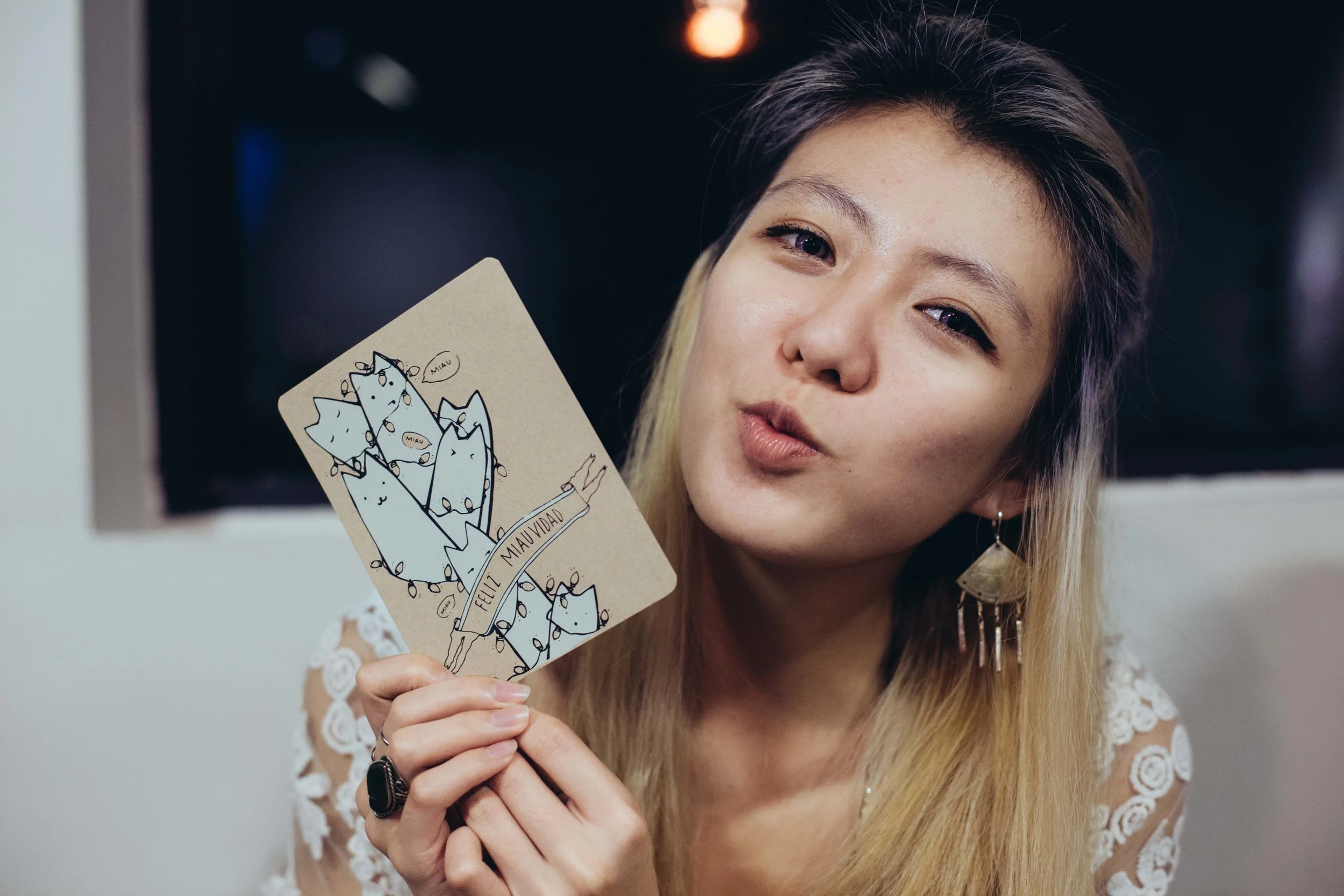 My dearest friend, Che, holding the postcard I made her for Christmas.