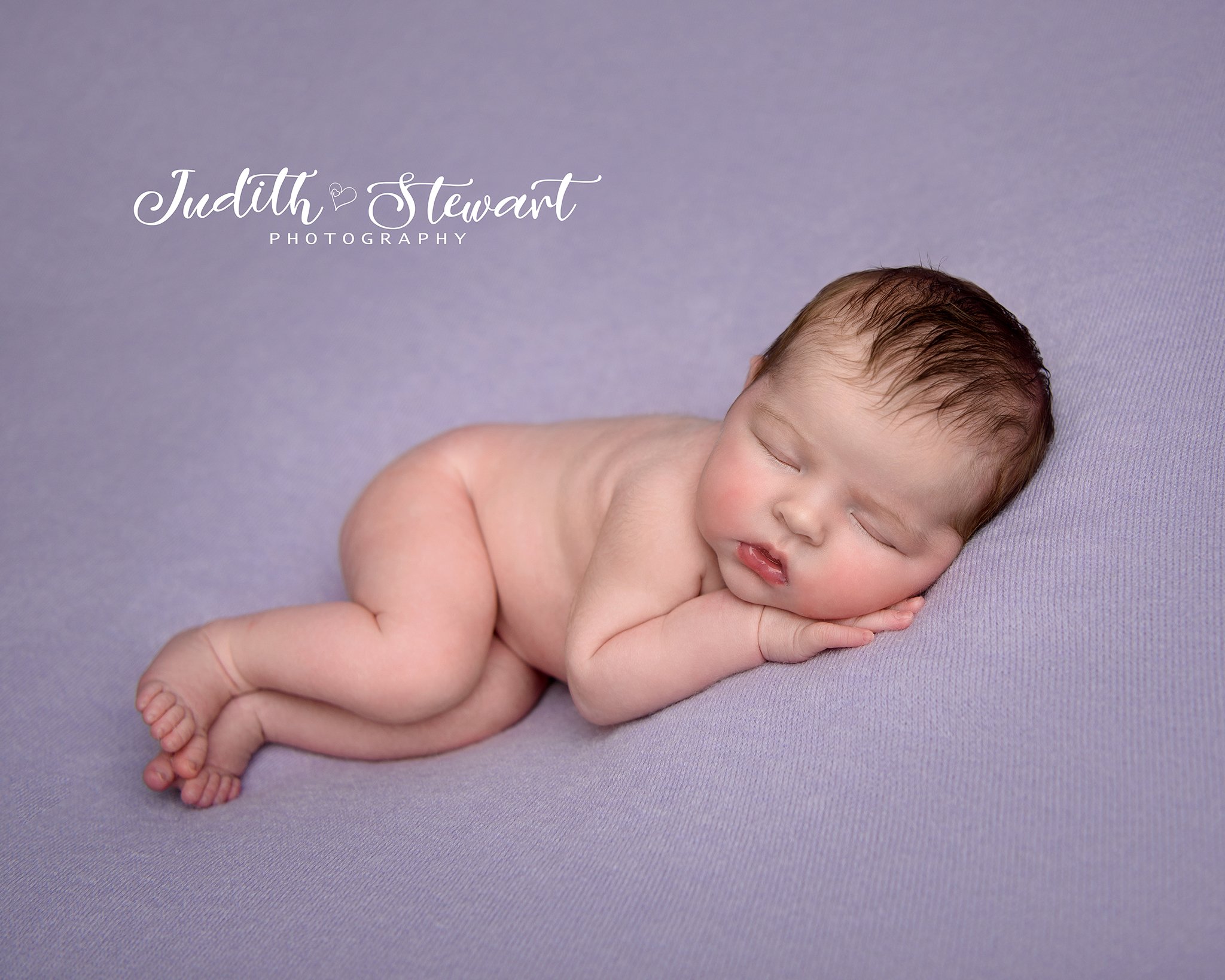  newborn on lilac in studio in uckfield east sussex with judith stewart baby photographer 