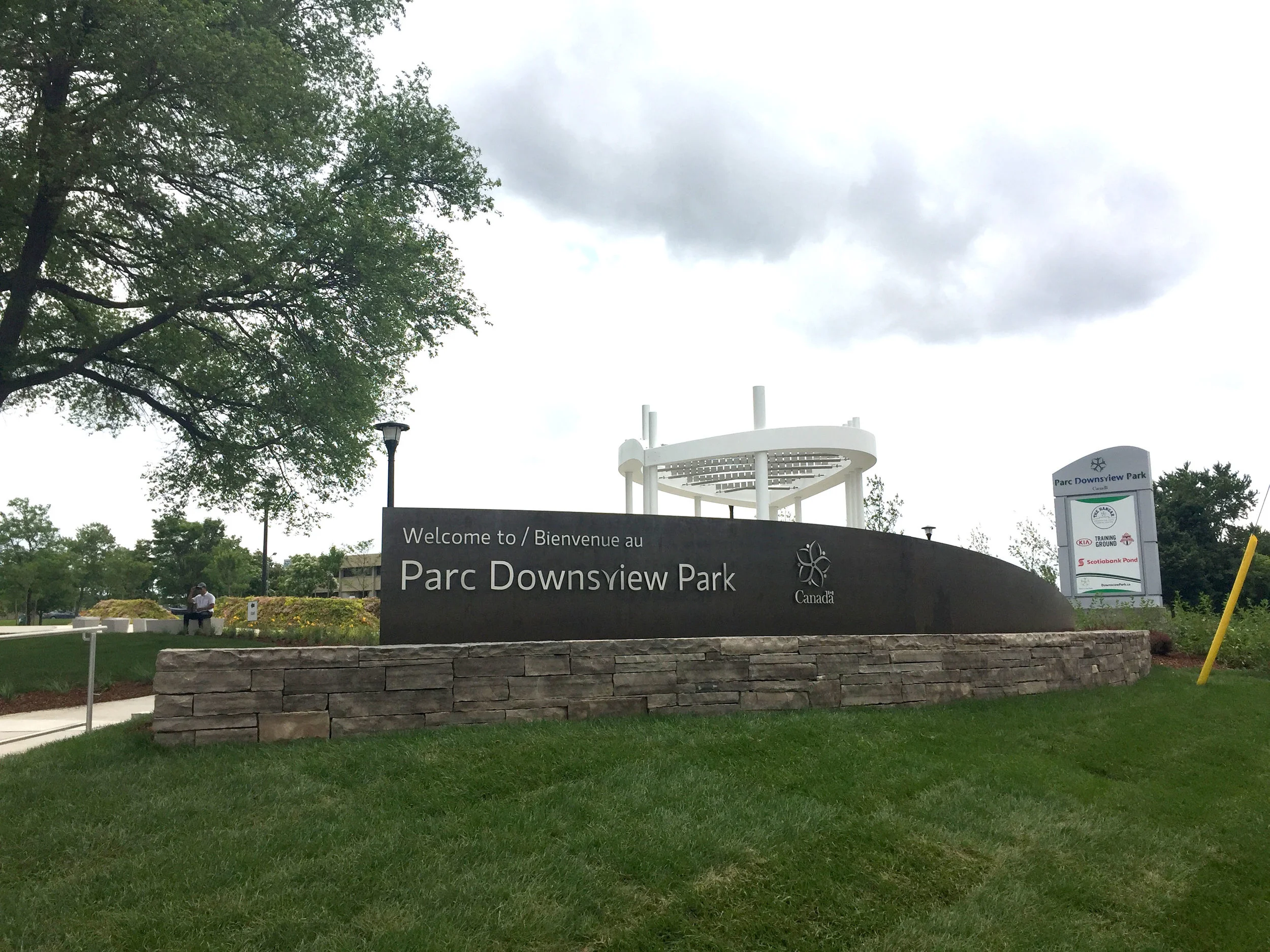  The sign is a large cor-ten sheet that wraps around the back of a dry stacked wall. The letters are individually cut pieces of stainless steel that are pinned in place. 