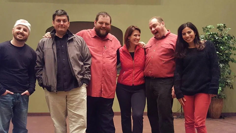 Ryan McChesney, Dave Zarbock, Dave Ebert, Angela Beckefeld, Jim Bushy, and Anna Yee pose after one of their shows. Their love for each other runs deep, wide, high and long.