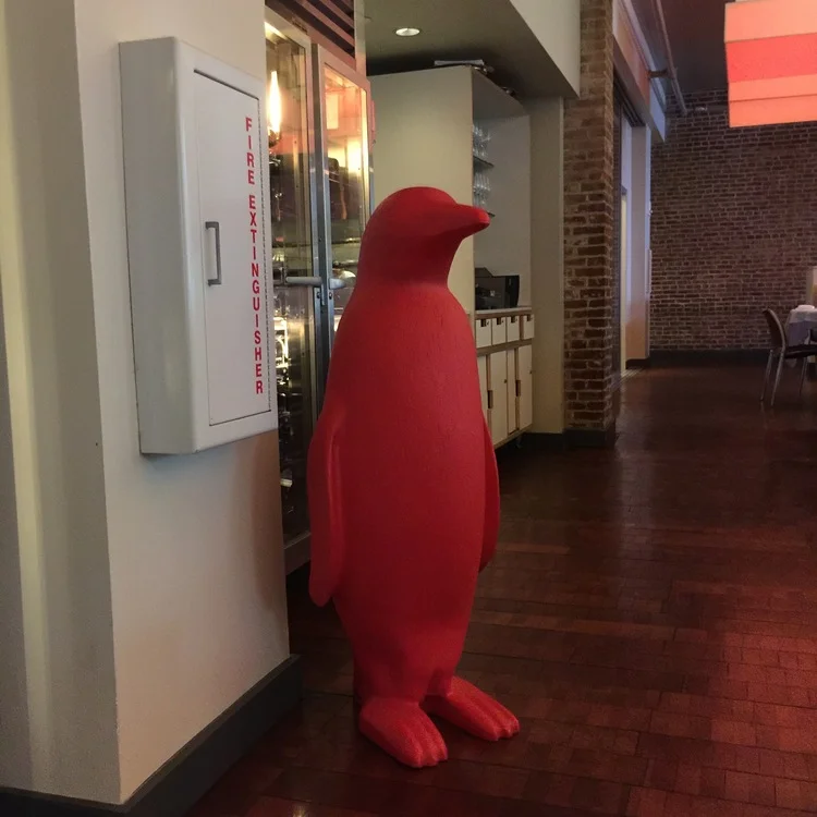 The Red Penguin sculptures that are exhibited throughout 21c were commissioned for a public art project at the 2005 Venice Biennale