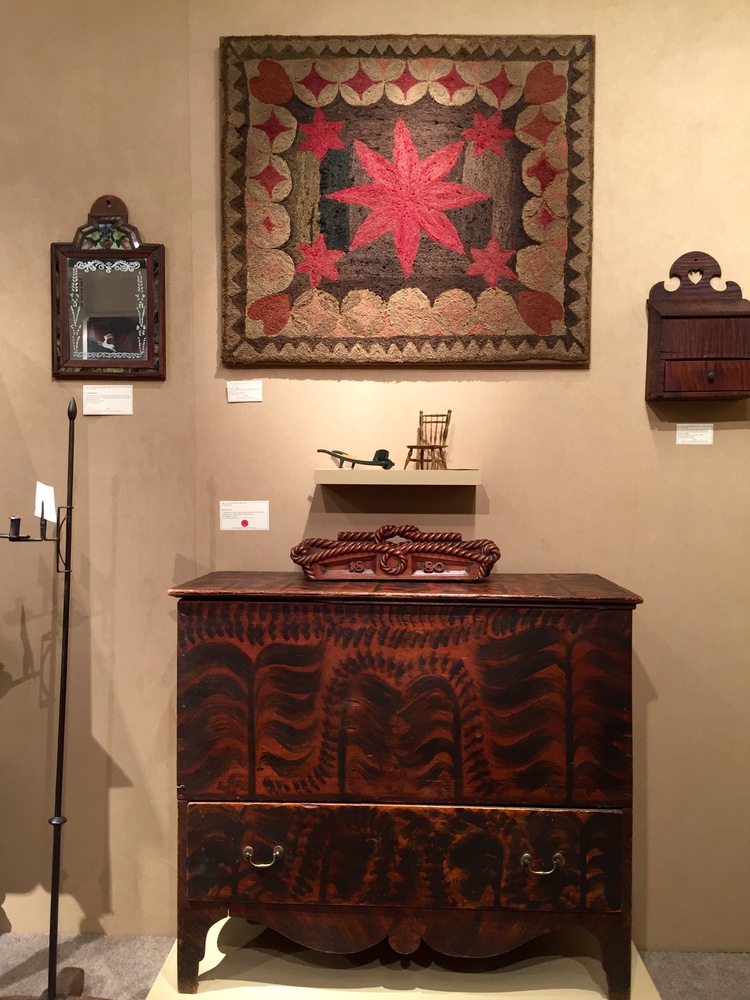 This vignette by Elliott & Grace Snyder featured a wonderfully colored antique hooked rug and a faux-grained blanket chest.
